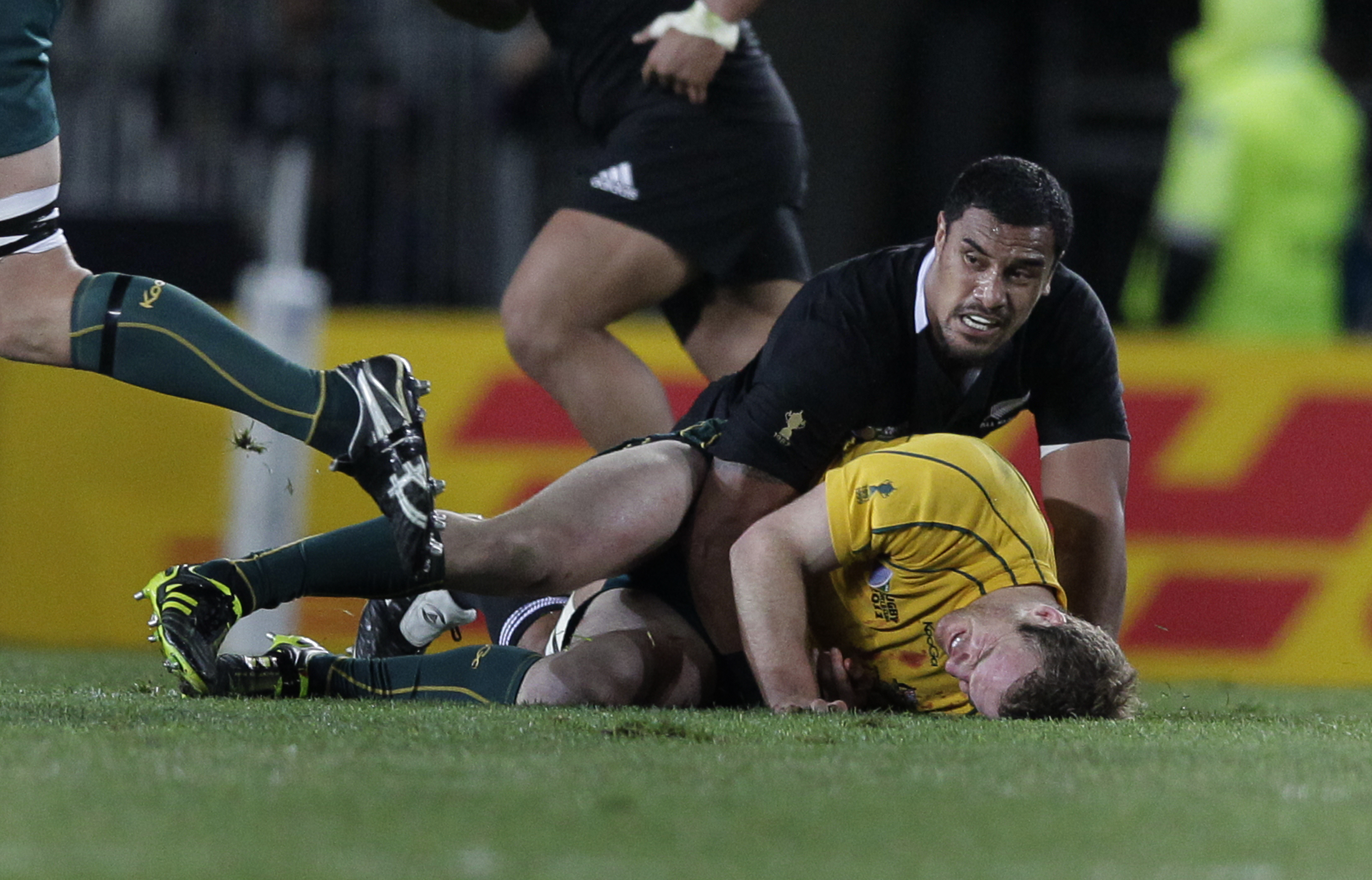 Jerome Kaino tackles David Pocock during the semifinal match between New Zealand and Australia at the 2011 Rugby World Cup at Eden Park. Photo / Brett Phibbs    