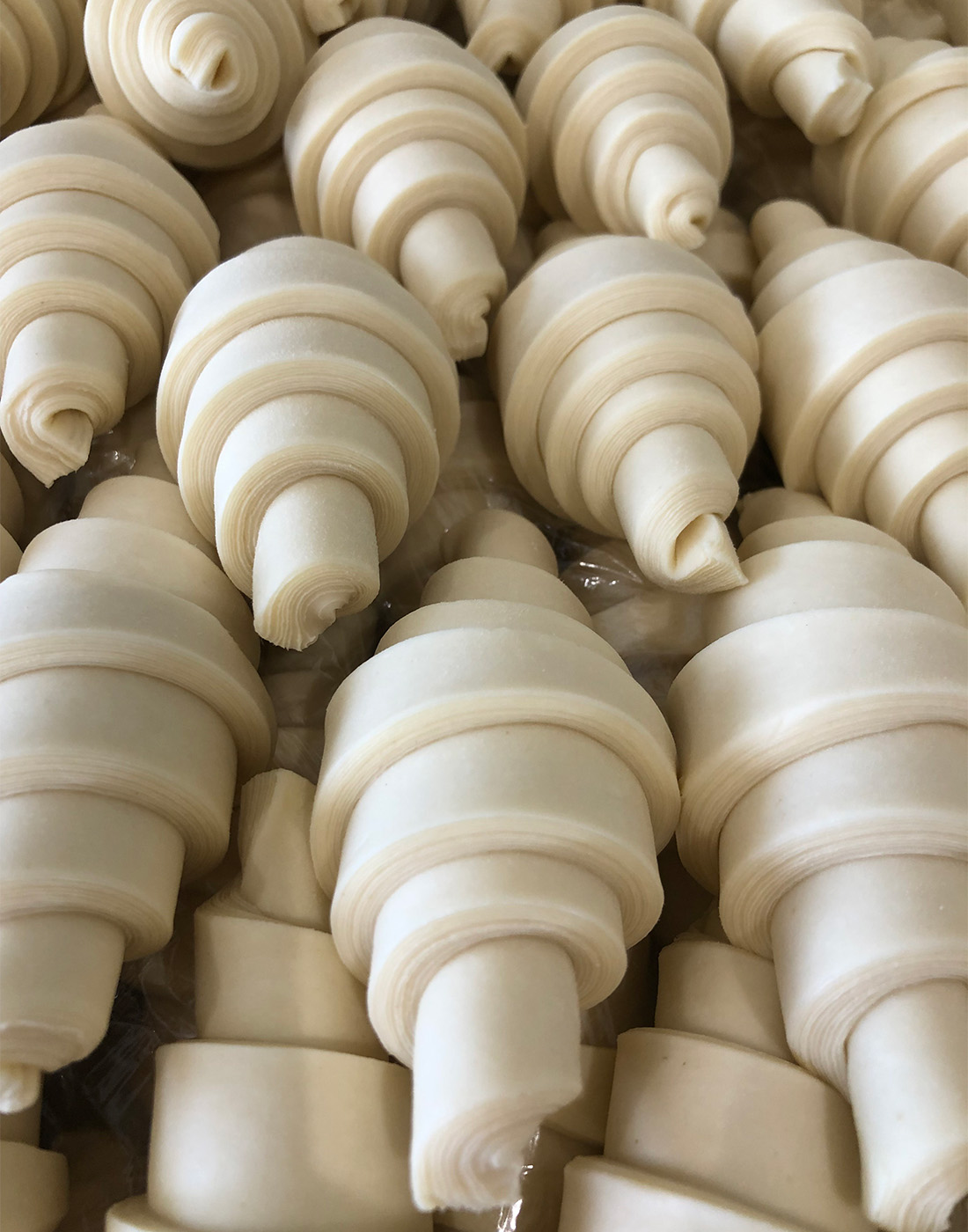 A pile of croissants before baking at Maison des Lys.
