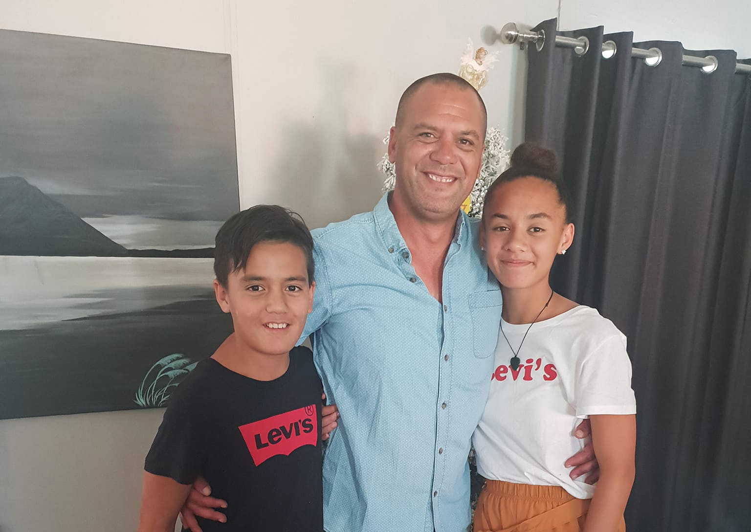 Bay of Plenty man Reon Wikeepa with his son, now 14, and daughter, now 16. Wikeepa died on Saturday trying to save family from the surf. Photo / Supplied