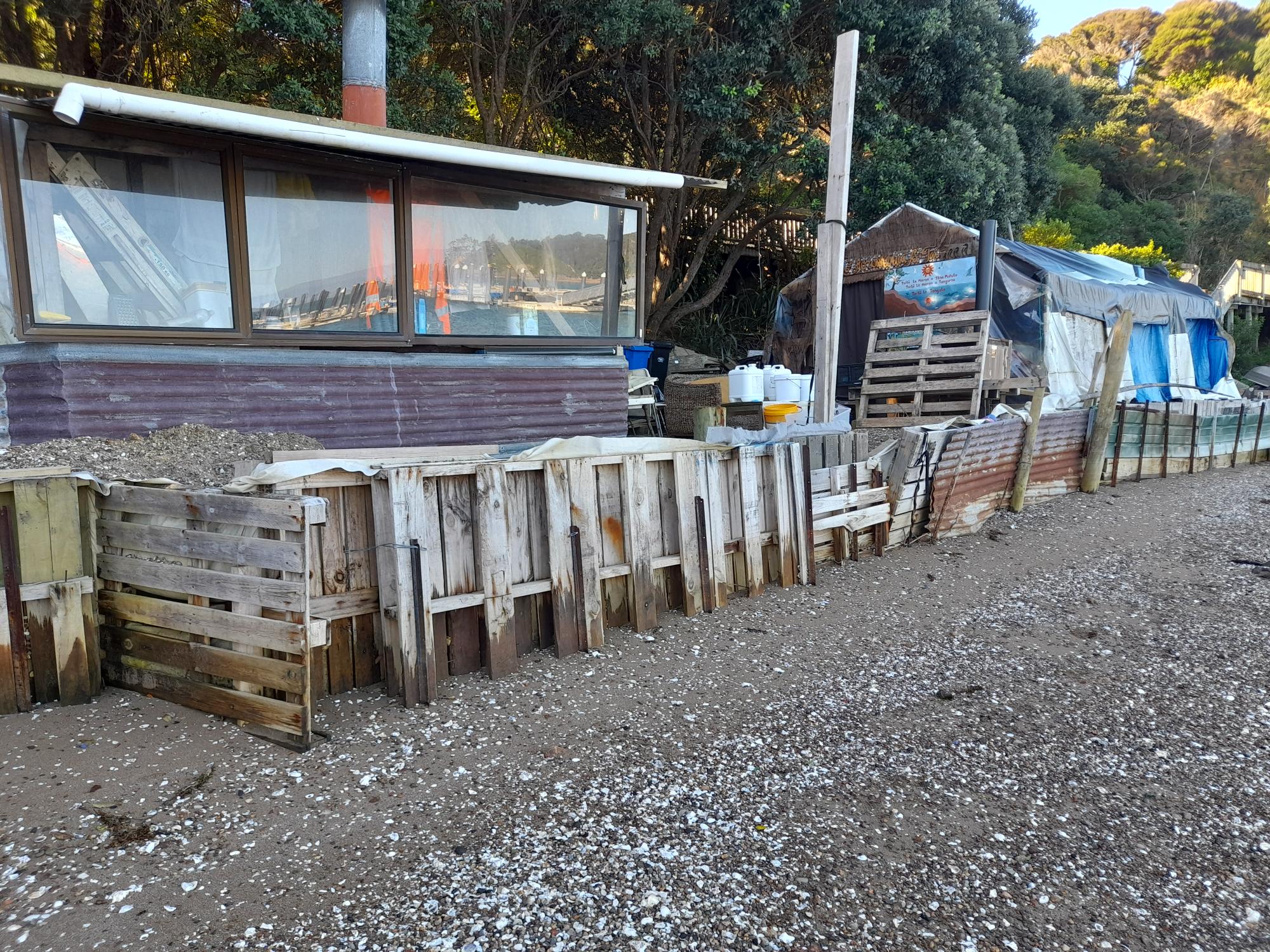 Structures on the beach at the bay where Auckland Council plans enforcement action.