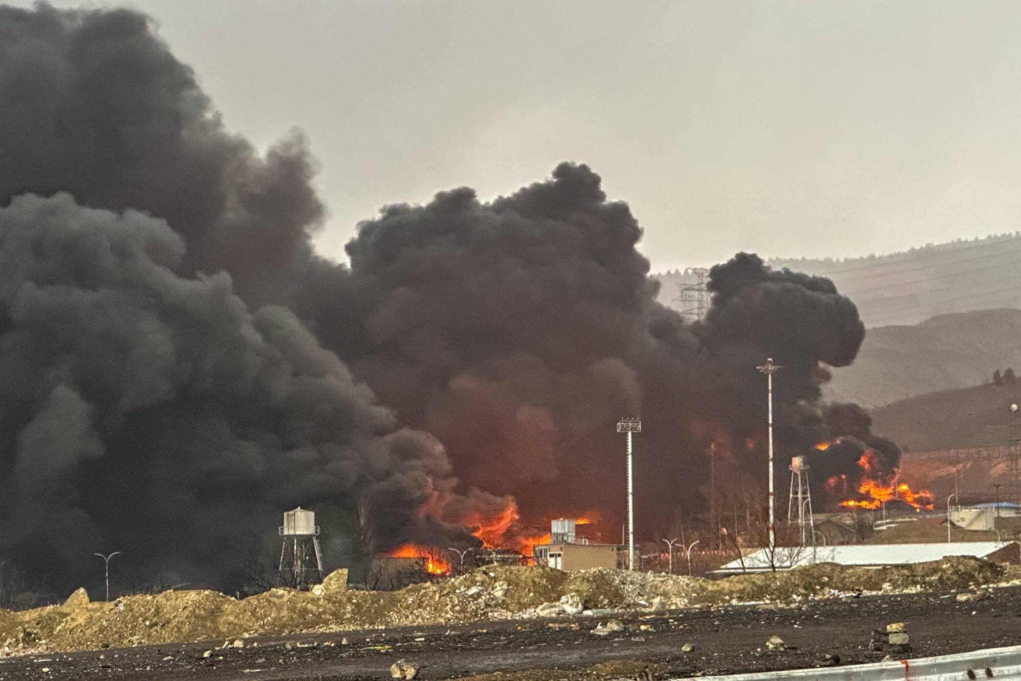 Smoke and flames rise at the site of airstrikes on an oil depot in Tehran on March 8. Photo / AFP