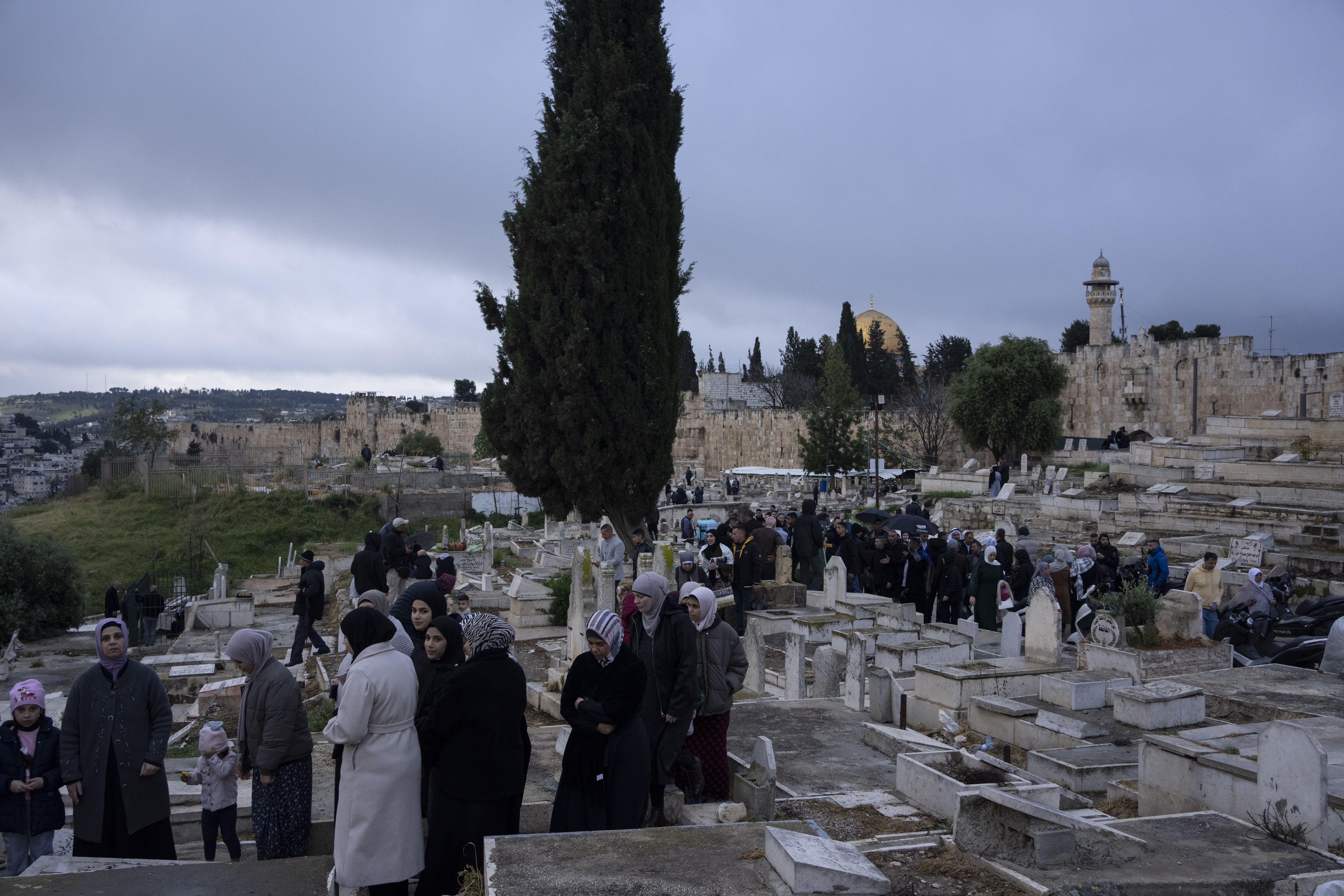 Palestinians visit the graves of their relatives after Eid al-Fitr prayers, during the celebrations at the end of the Muslim holy fasting month of Ramadan. Photo / AP