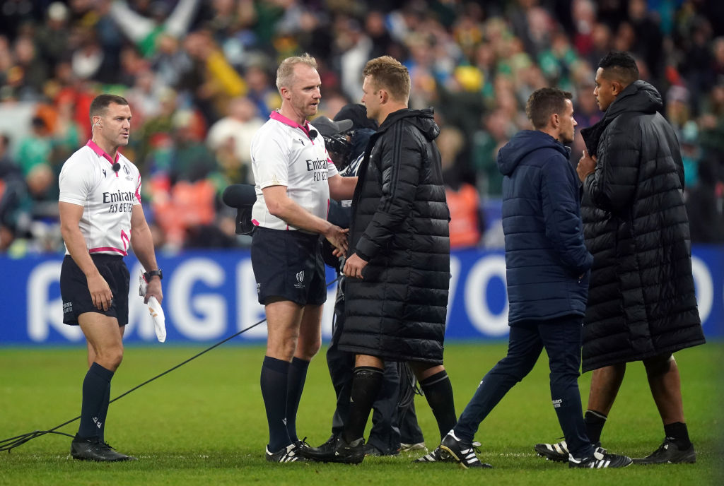 Sam Cane, who was shown a red card, with referee Wayne Barnes at the final whistle. Photo / Getty Images