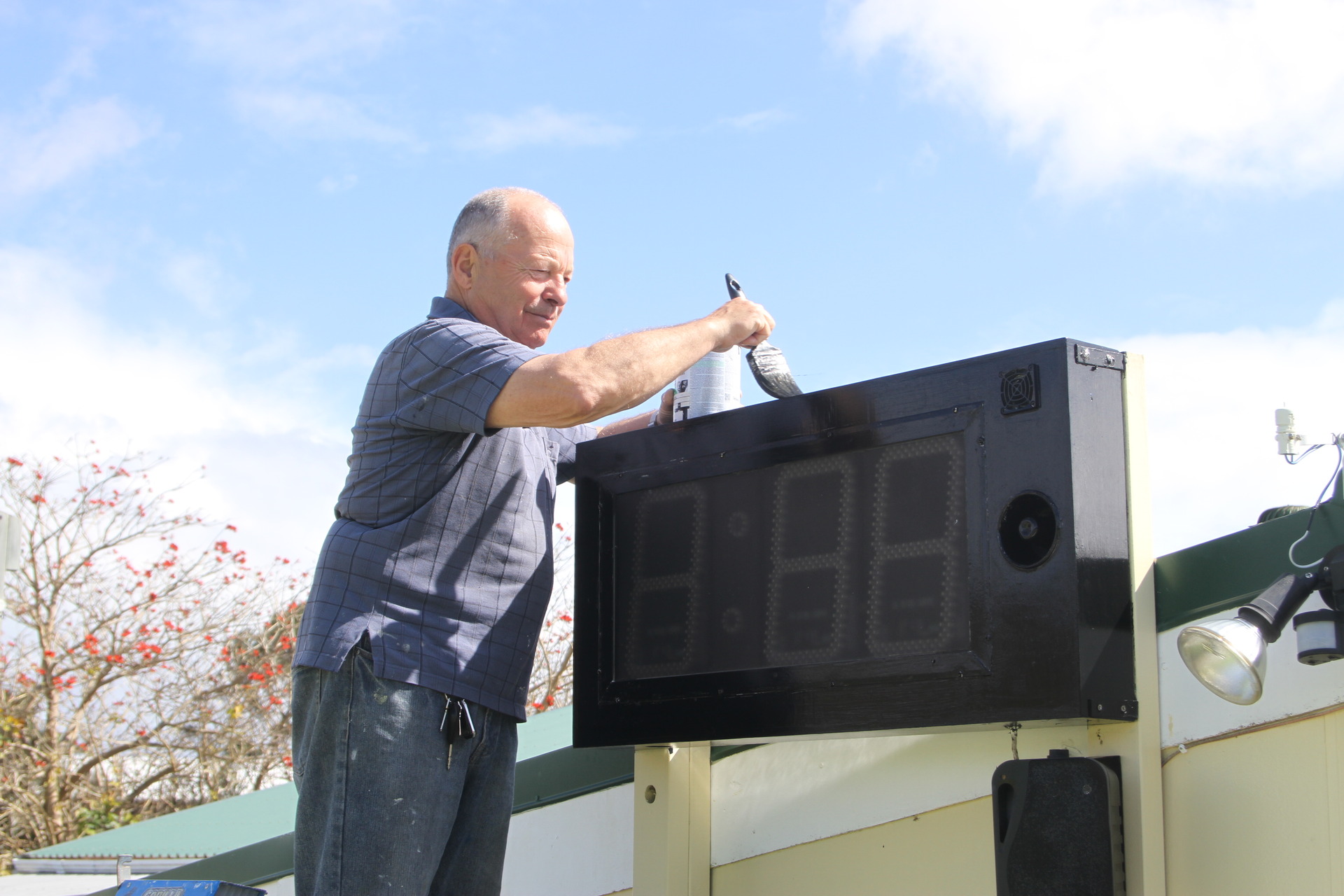 Jim Naylor wields a paint brush at his bowling club on Friday after being named Bowls New Zealand's Club Person of the Year. What else would he be doing?
