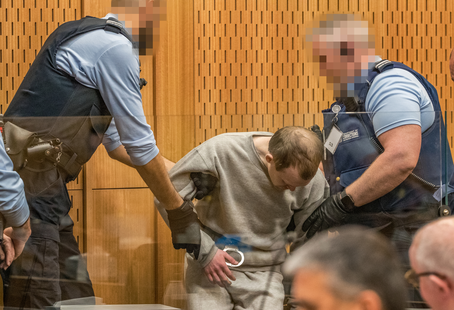 The terrorist being led into court for his sentencing. Photo / Pool