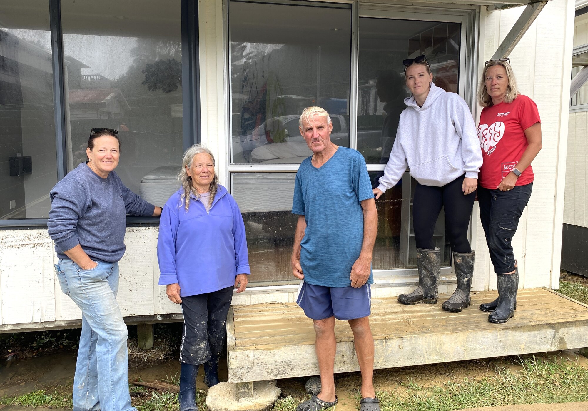 The Morgans are a Whangārei family who have called their Ōakura bach their holiday haven for 14 years. Tracy Morgan, left, says the water was up to her waist on Sunday morning, with everything in the bach damaged. Photo / Denise Piper