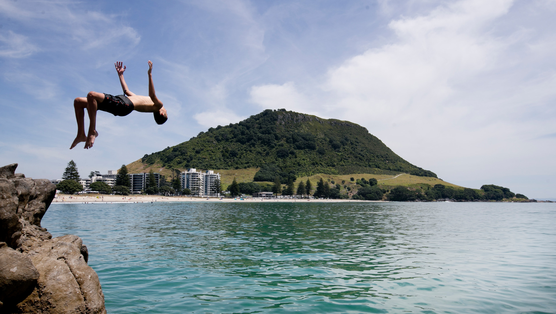 Taking the plunge at Mt Maunganui. Photo / Alan Gibson