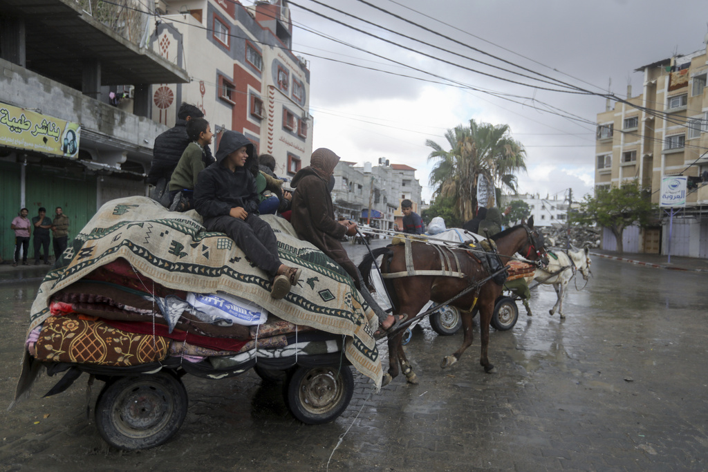 Palestinians flee from the eastern side of Rafah after the Israeli army orders them to evacuate ahead of a military operation. Photo / AP
