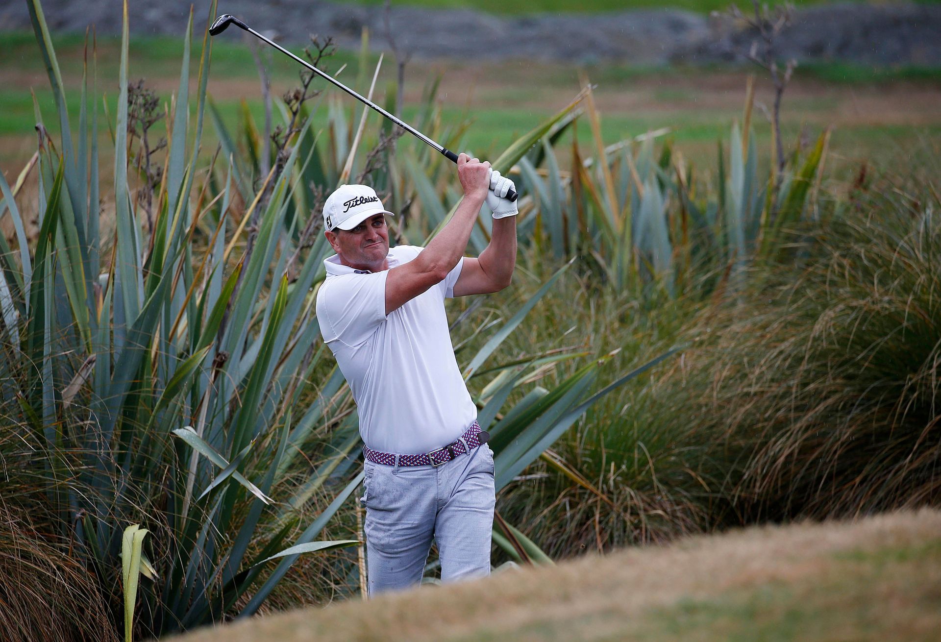 Hamish Edwards in action at The Hills golf course. Photo / Photosport