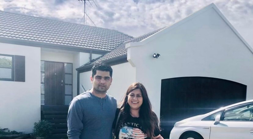 Ameet Bhargav and his wife Renu outside their leaky house in Goodwood Heights, Manukau shortly after buying the property in 2020. Photos / Supplied