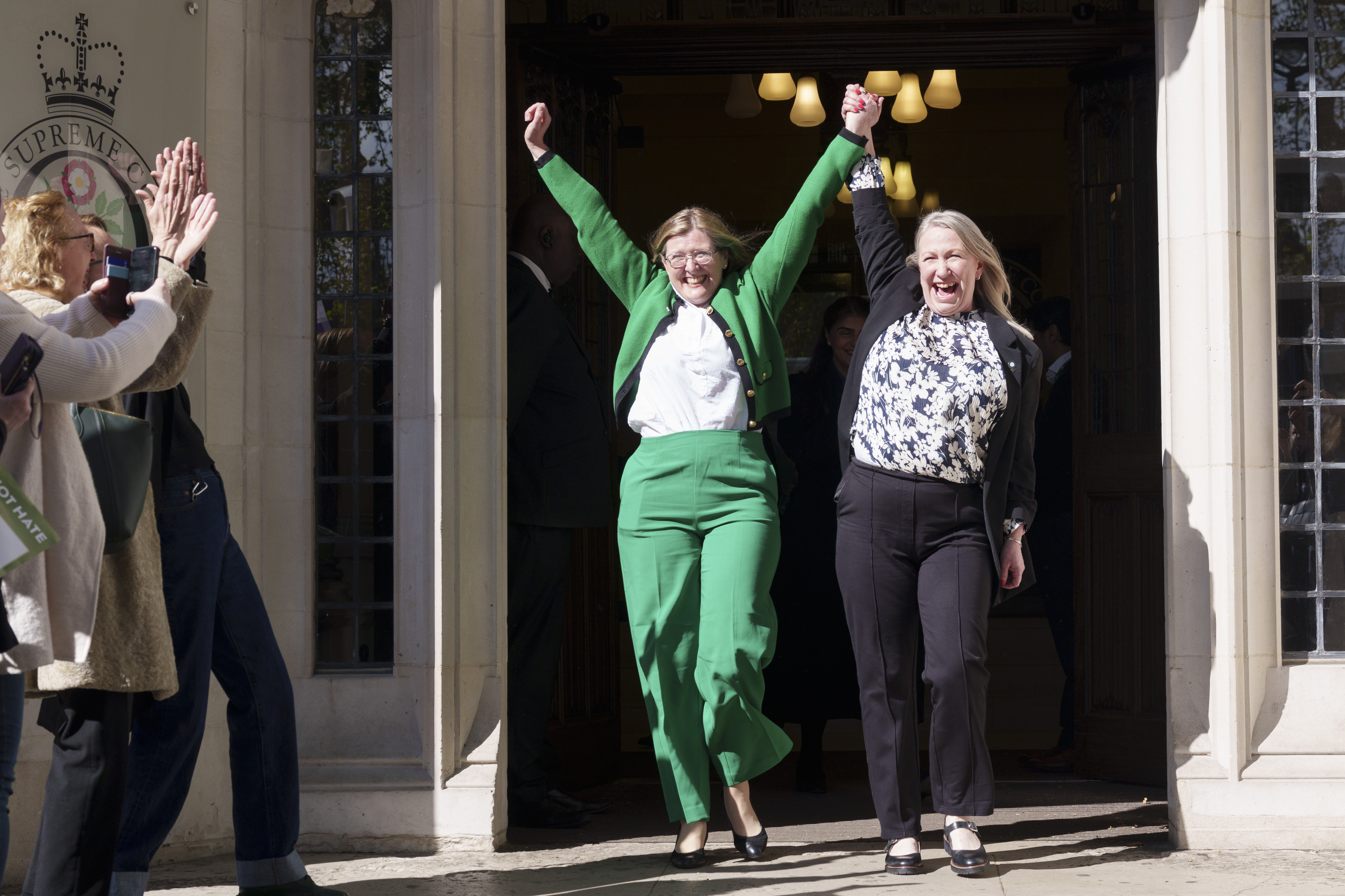 For Women Scotland directors Susan Smith and Marion Calder cheer as they leave the UK Supreme Court in London. Photo / Getty Images