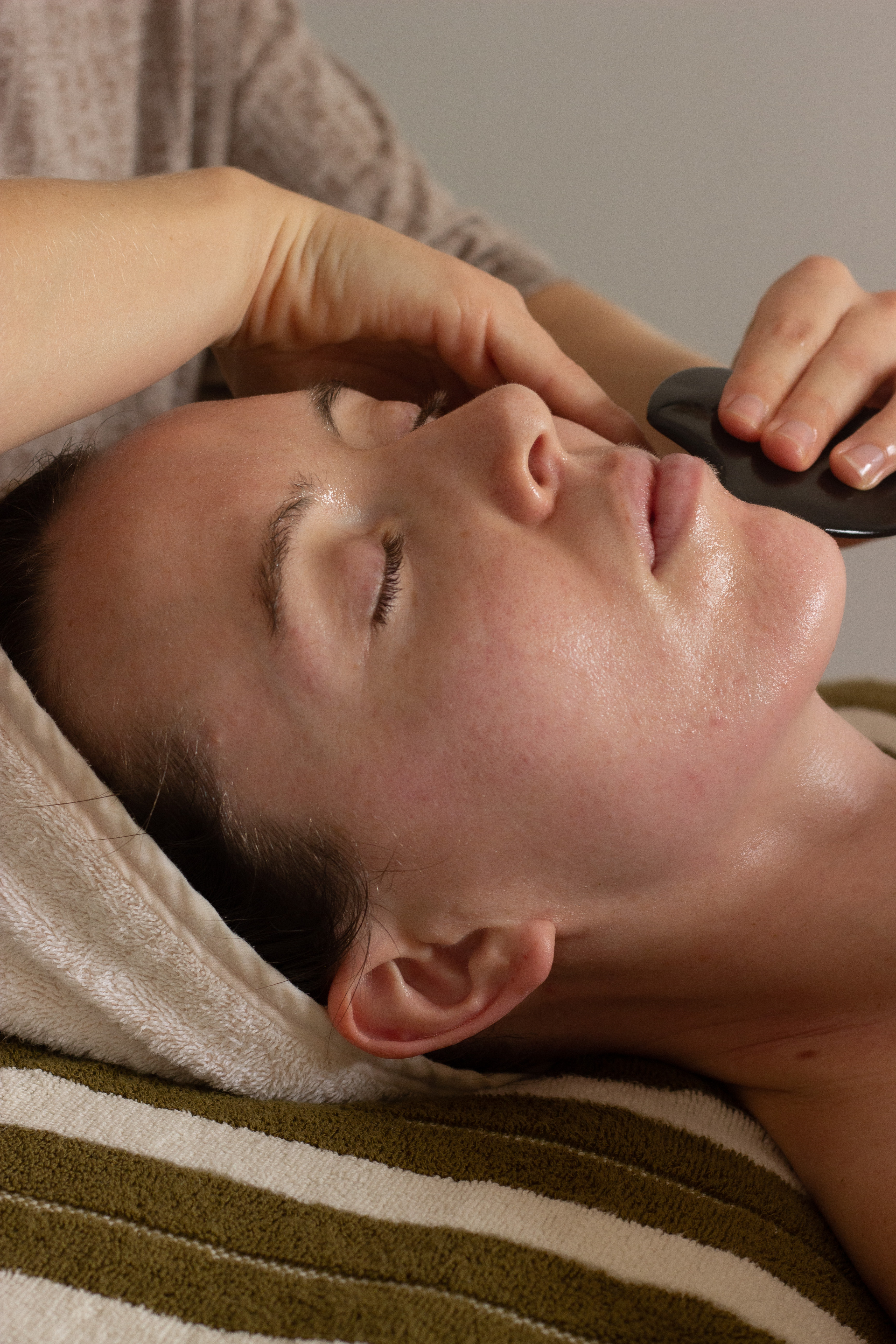 Facialist Andrea McCall uses a gua sha to encourage circulation and release tension in the facial muscles. Photo / Sophia Doak