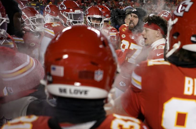 Kansas City Chiefs quarterback Patrick Mahomes, second from right, and tight end Travis Kelce, third from right, huddle with teammates before an NFL wild-card playoff football game. Photo / AP