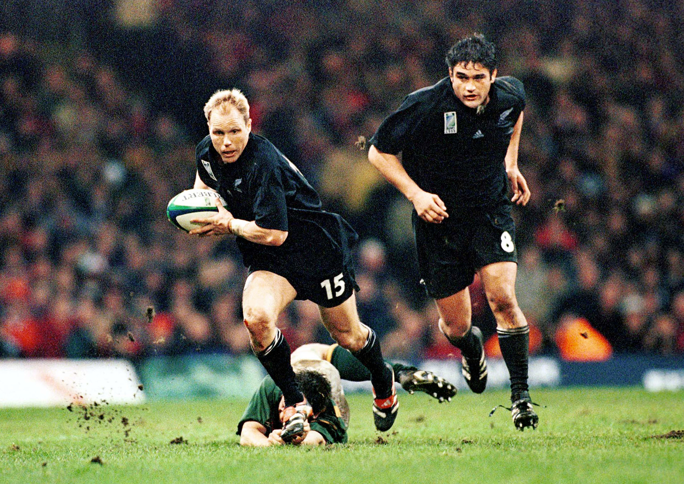 Jeff Wilson makes a break against South Africa at the 1999 Rugby World Cup. Photo / Photosport