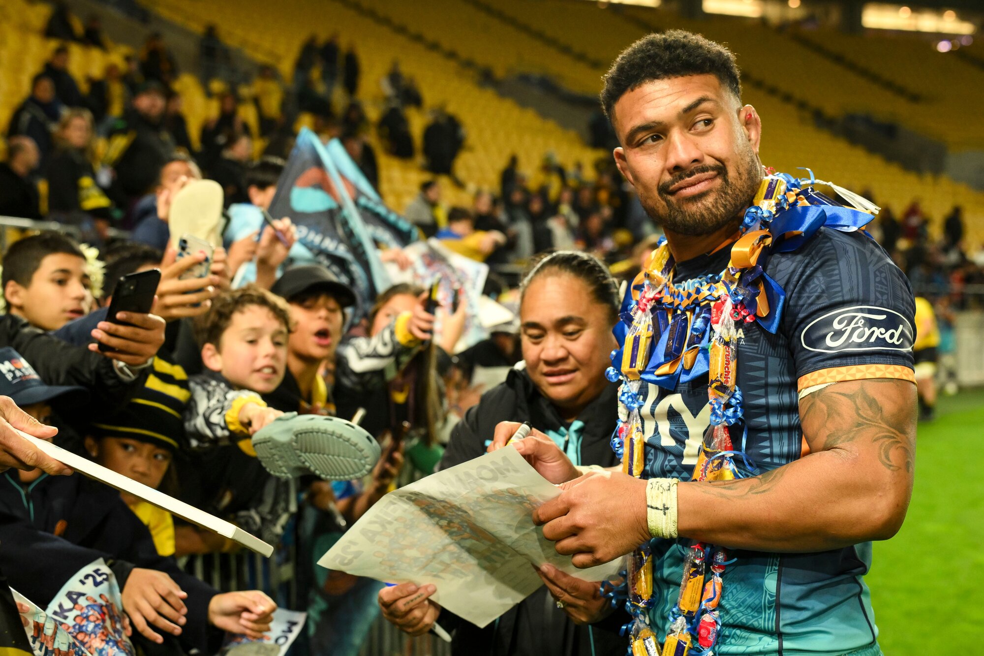 Ardie Savea, of Moana Pasifika, with fans after facing the Hurricanes. Photo / Photosport