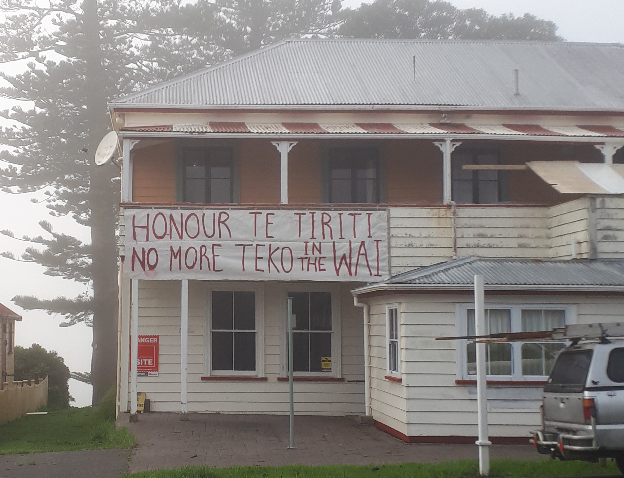 Another protest sign in Rāwene opposes plans to continue discharging wastewater into the Hokianga Harbour.