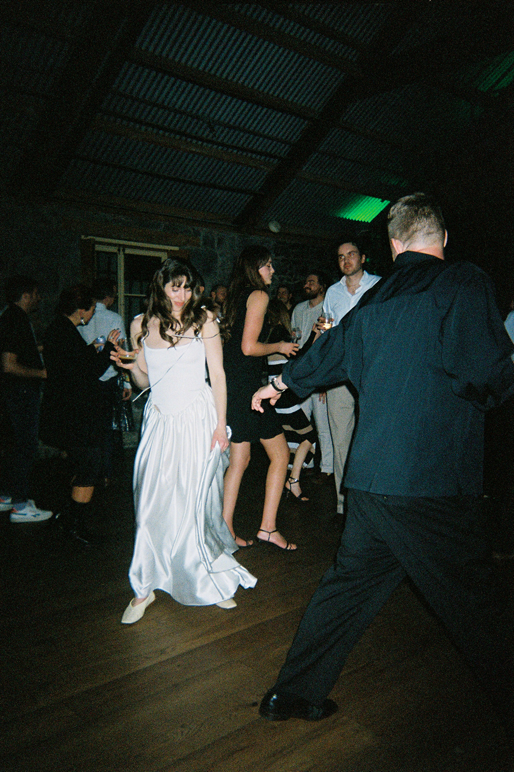 The bride's second dress was a take on a classic Rachel Mills dress. Photo / Wedding guest via disposable camera