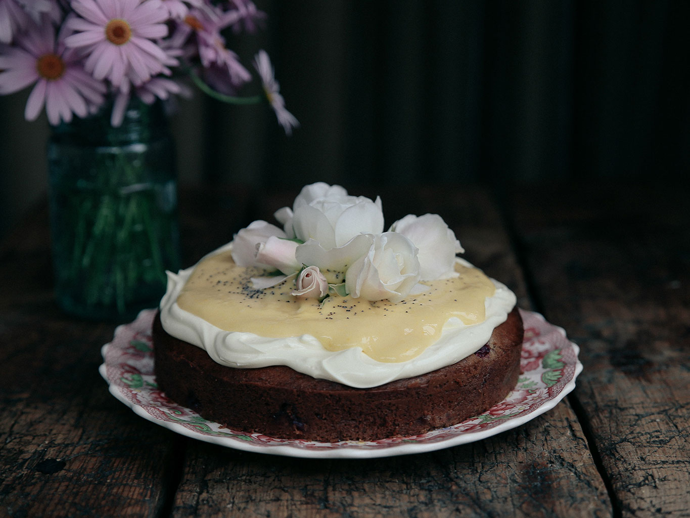 This banana cake is topped with wonderfully lush lemon curd. Photo / Eleanor Ozich.