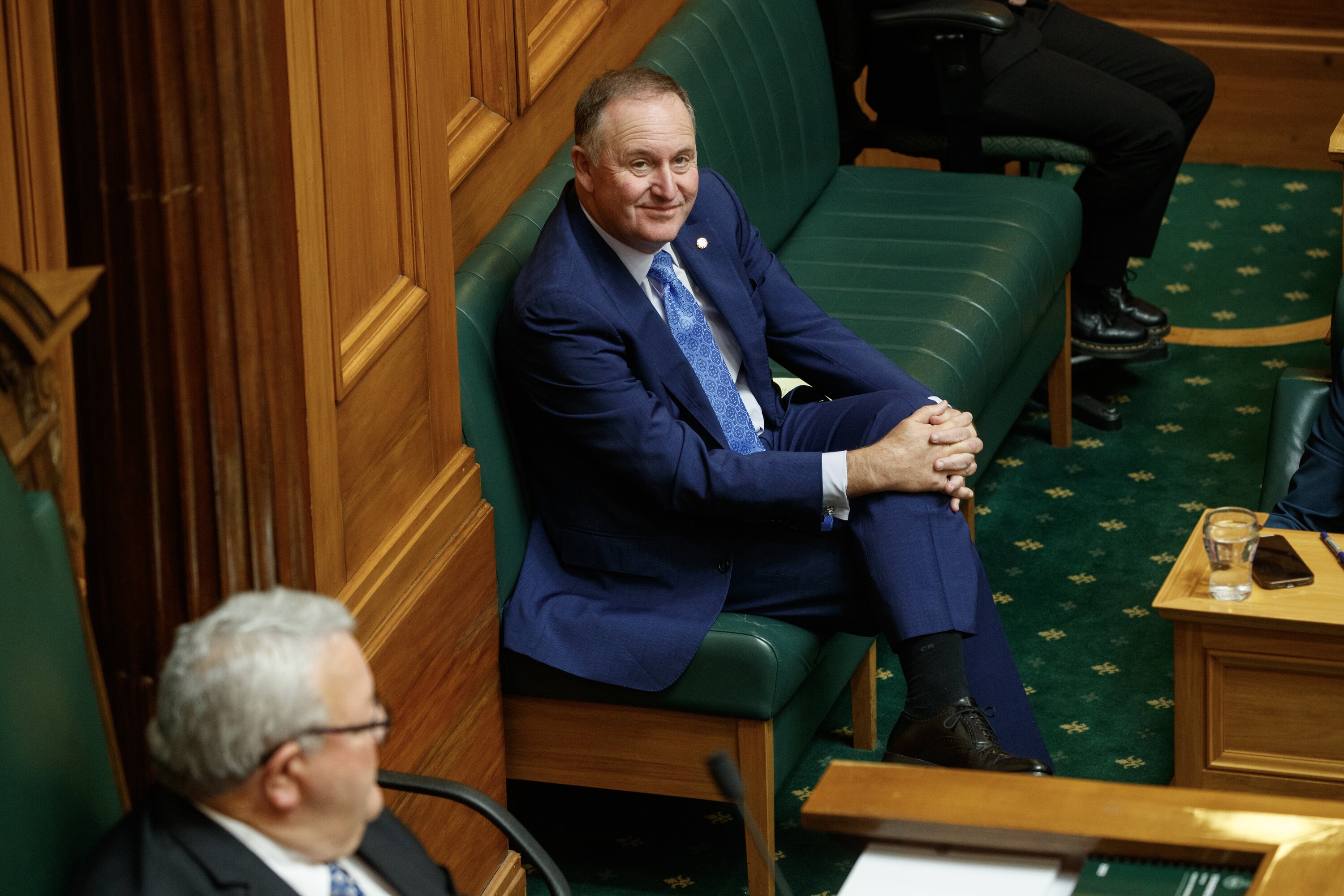 Former Prime Minister Sir John Key watches PM Christopher Luxon in Question Time. Photo / Mark Mitchell  