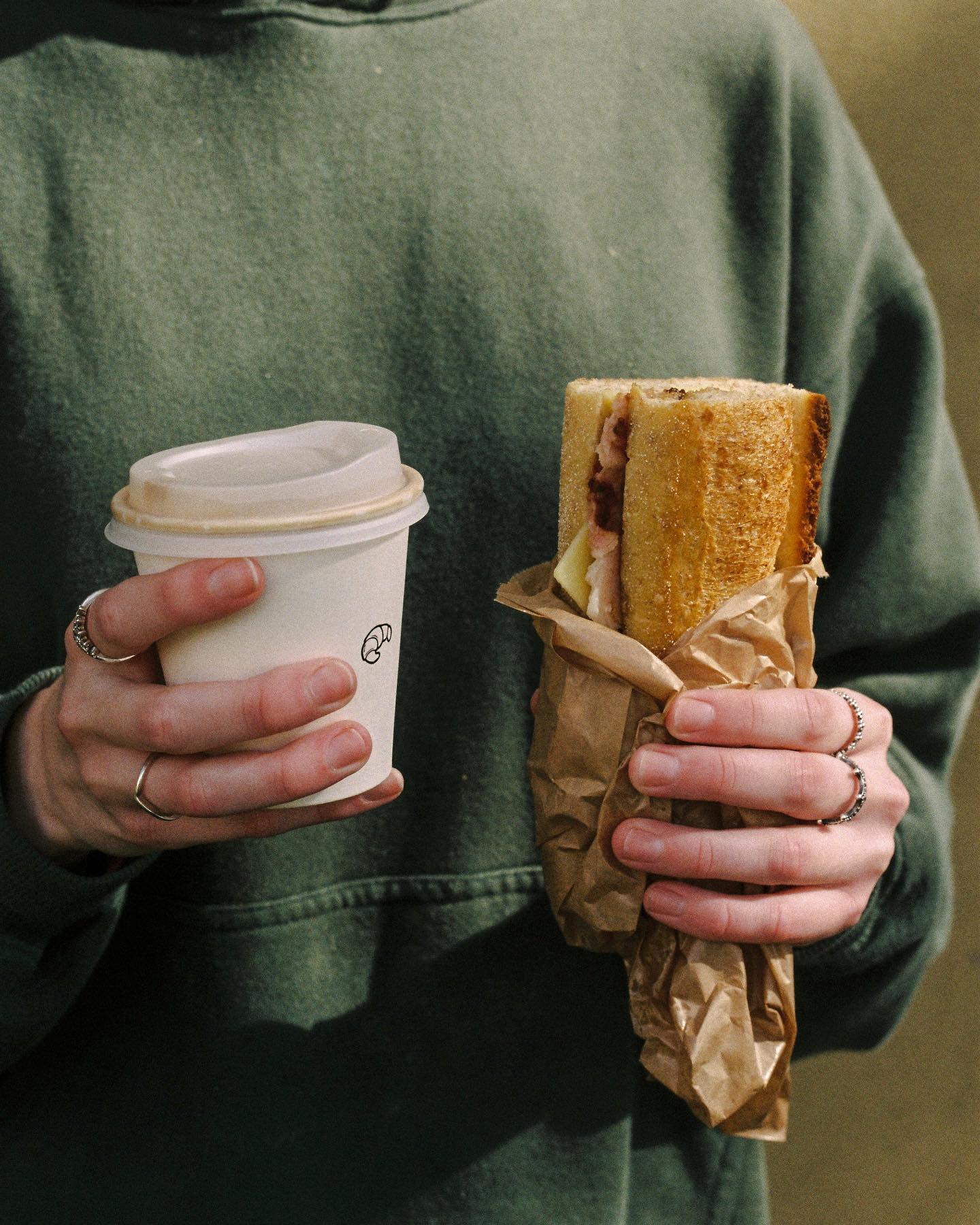 Daily Bread's ham and cheese baguette with a little orange mustard. Photo / @Dailybreadnz