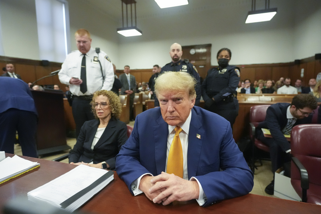 Former US President Donald Trump, joined by his attorney Susan Necheles, sits at the defence table in Manhattan criminal court today. Photo / AP