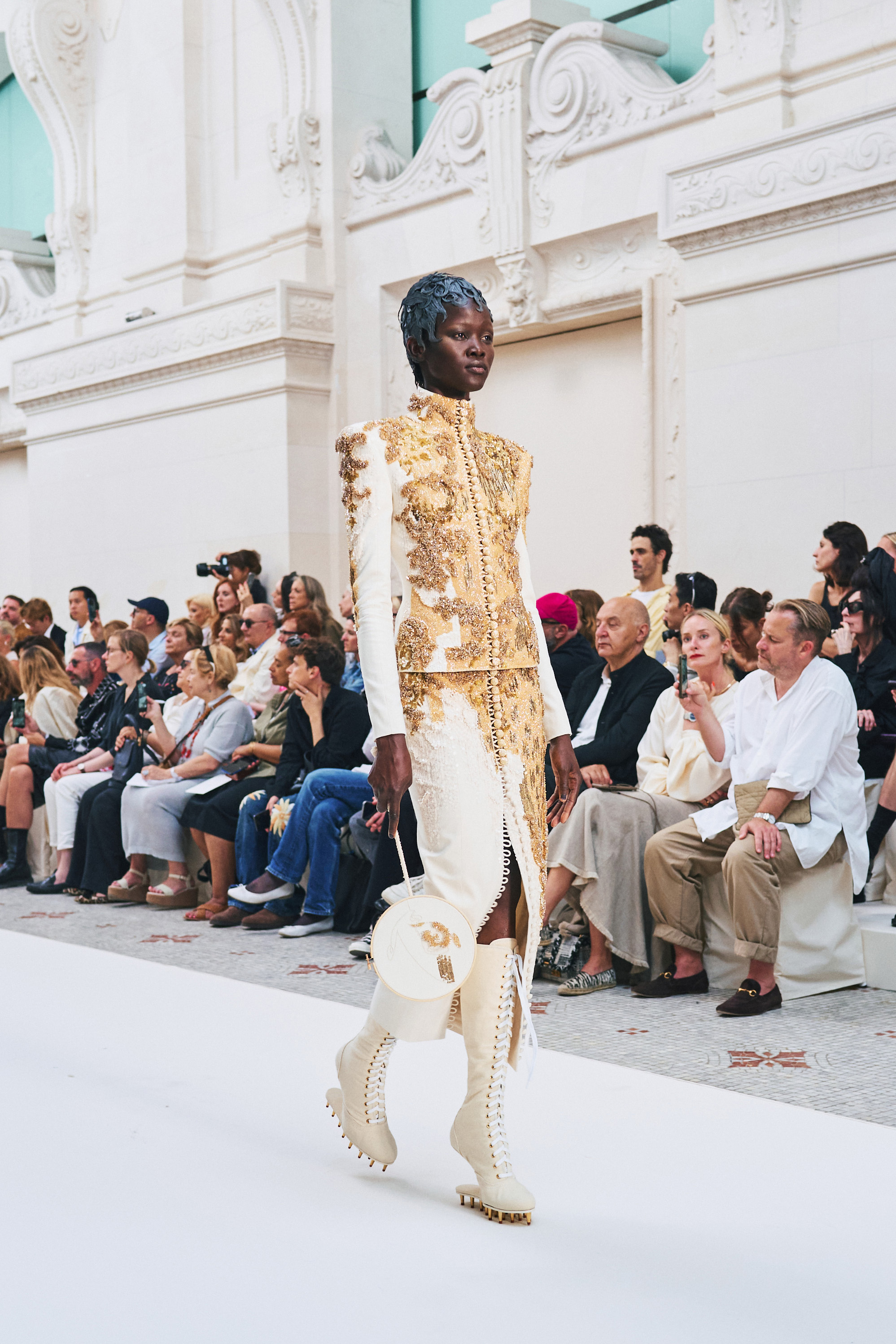 An ornate outfit with endless buttons and laces at the Thom Browne show. Photo / New York Times