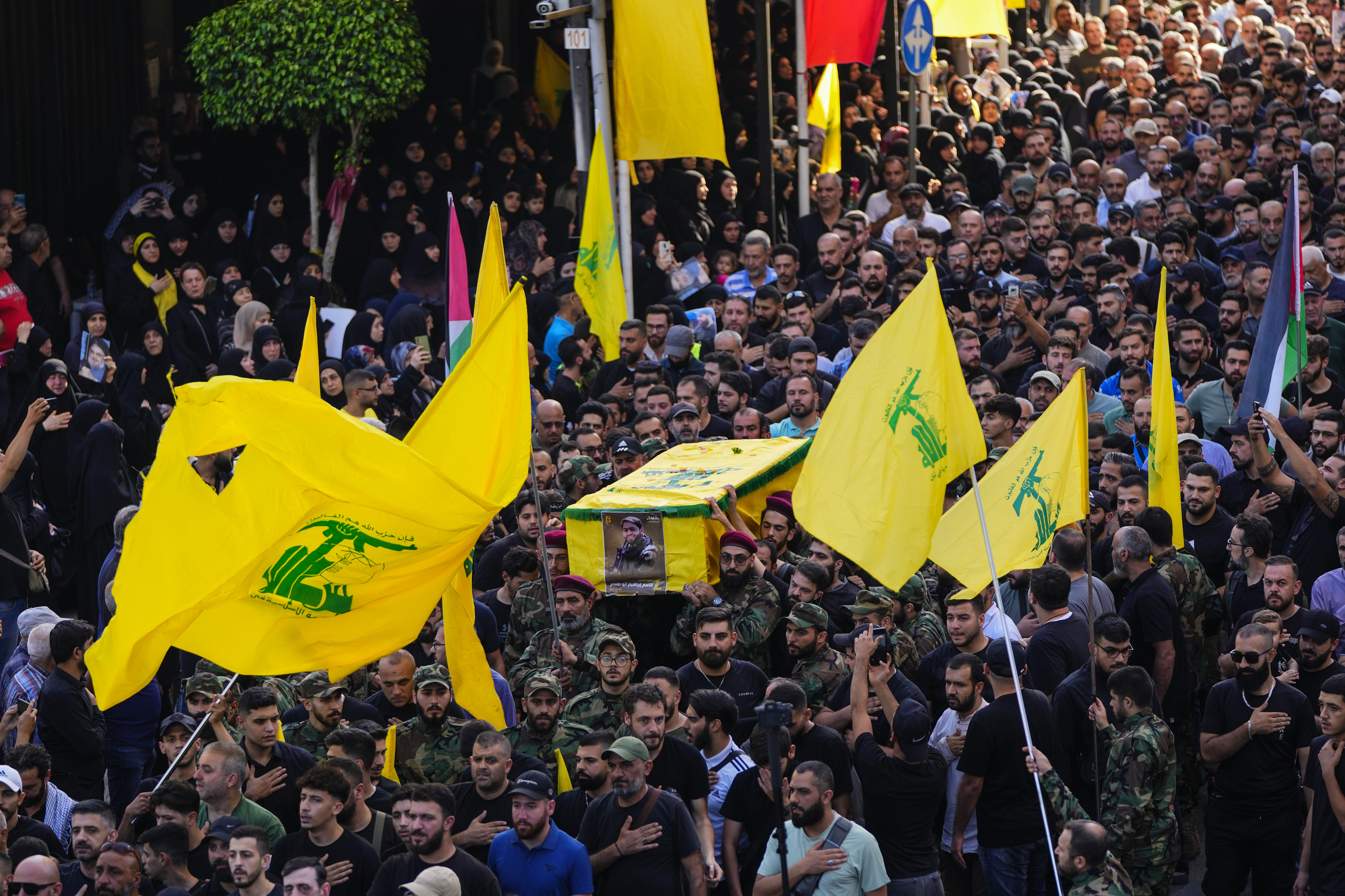 Hezbollah fighters carry the coffin of their comrade, Qassim Ibrahim Abu-Taam, who was killed along Lebanon's southern border with Israel. Photo / AP