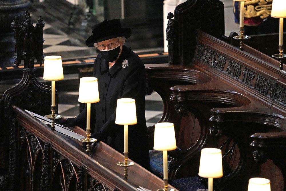 The late Queen Elizabeth II watches as pallbearers carry the coffin of Prince Philip, duke Of Edinburgh into St George’s Chapel at Windsor Castle, April 2021. Photo / Getty Images