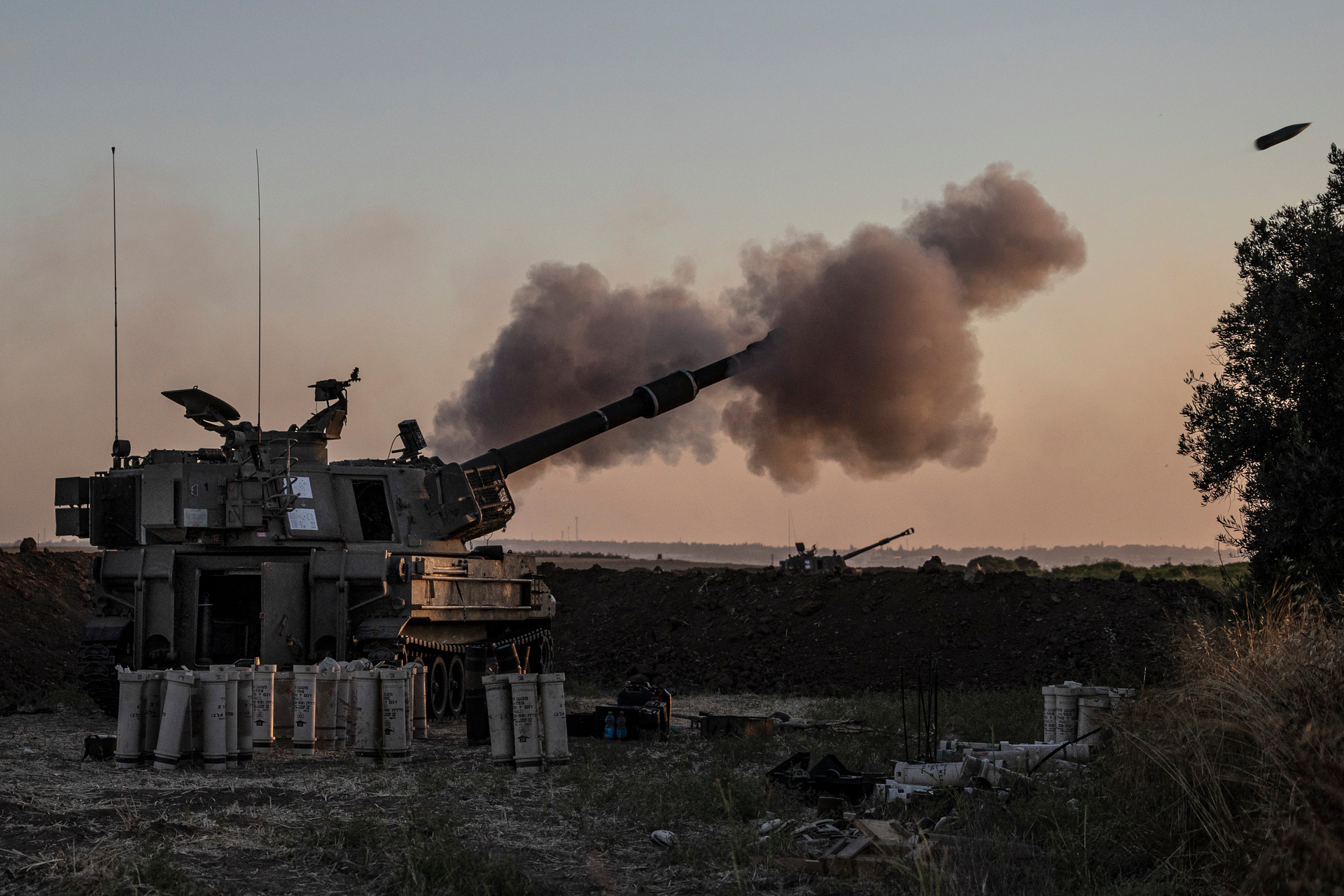 An Israeli artillery unit fires toward targets in Gaza Strip, at the Israeli Gaza border. Photo / AP