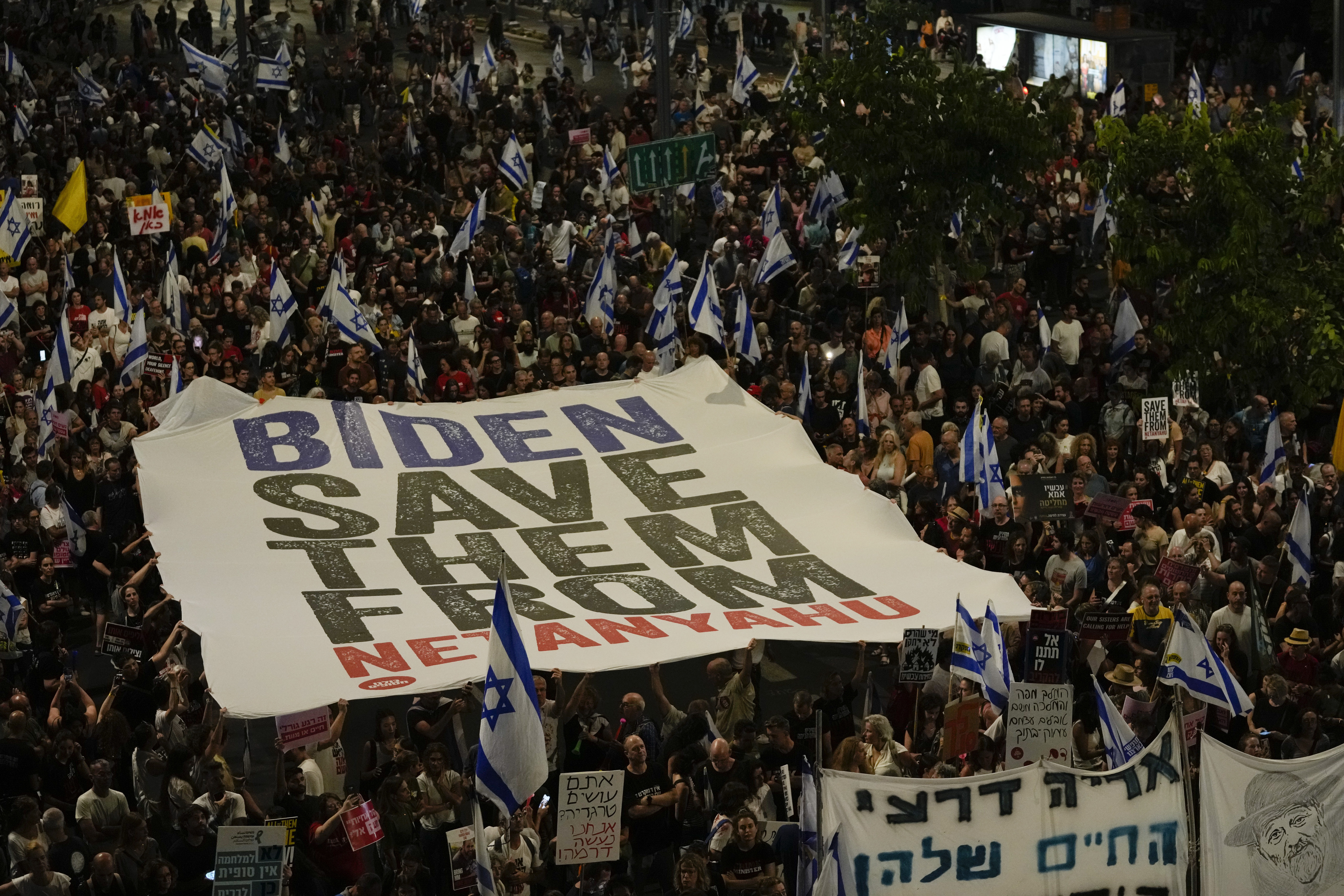 People protest against Israeli Prime Minister Benjamin Netanyahu's government and call for the release of hostages held in the Gaza Strip by the Hamas militant group in Tel Aviv, Israel. Photo / AP