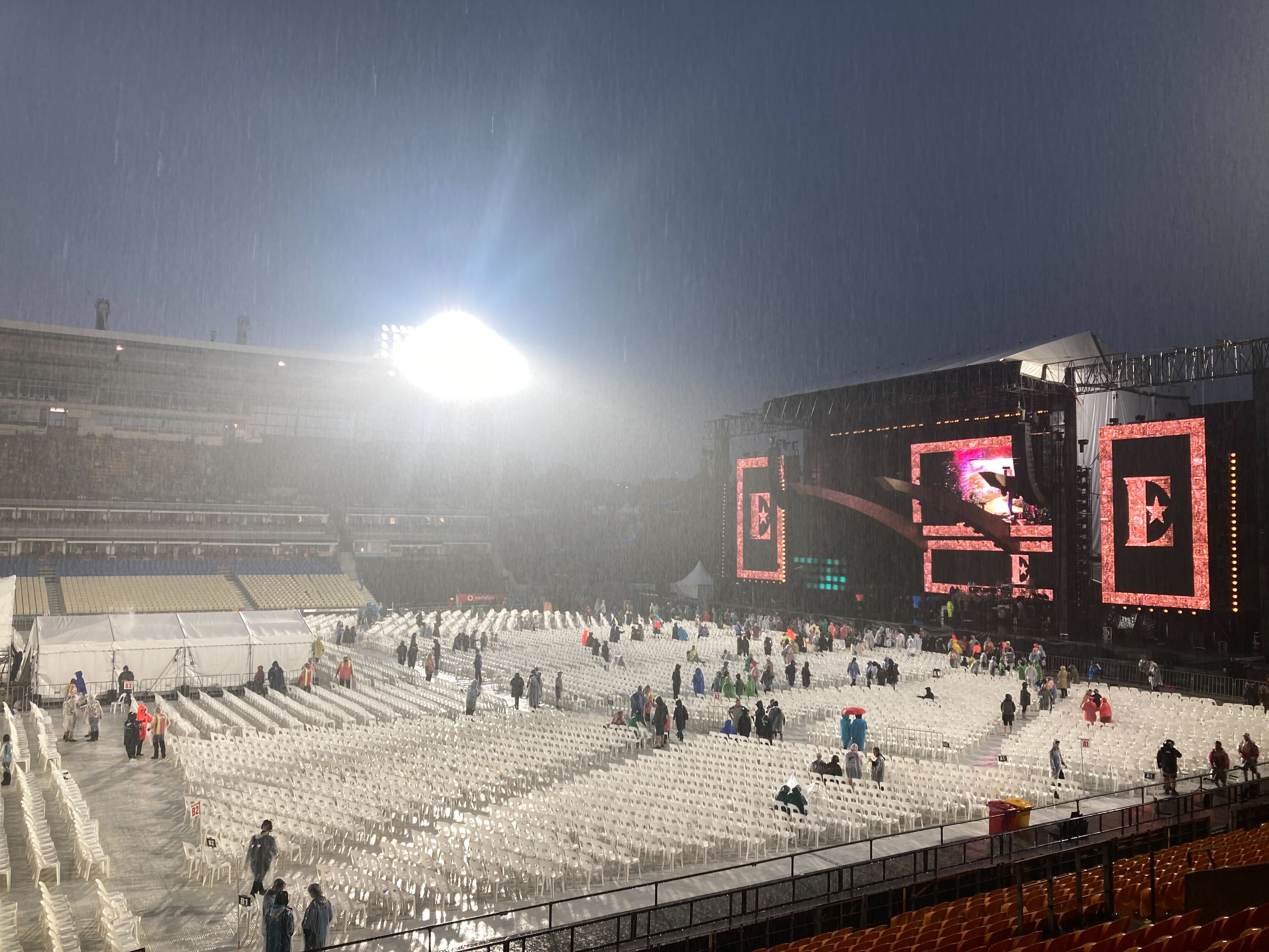 Elton John concert-goers evacuate Mt Smart Stadium after announcements the concert was cancelled following heavy rain. Photo / Nick Bewley