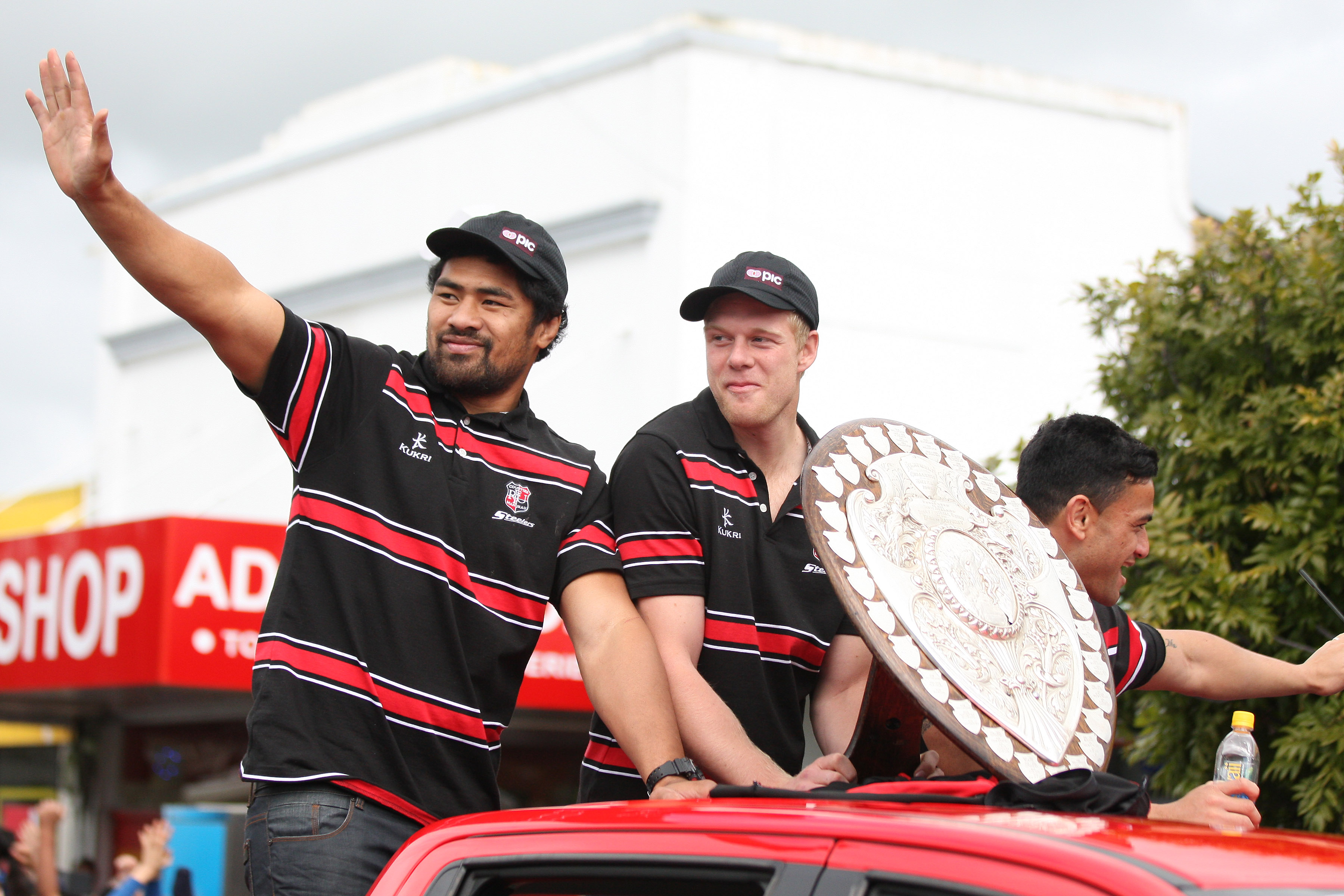 The shield still has pulling power. Counties captain Fritz Lee (from left), Baden Kerr and Sherwin Stowers with the Shield as fans turned out to line Great South Road in Papakura to see the team parade in 2013. Photo / Photosport