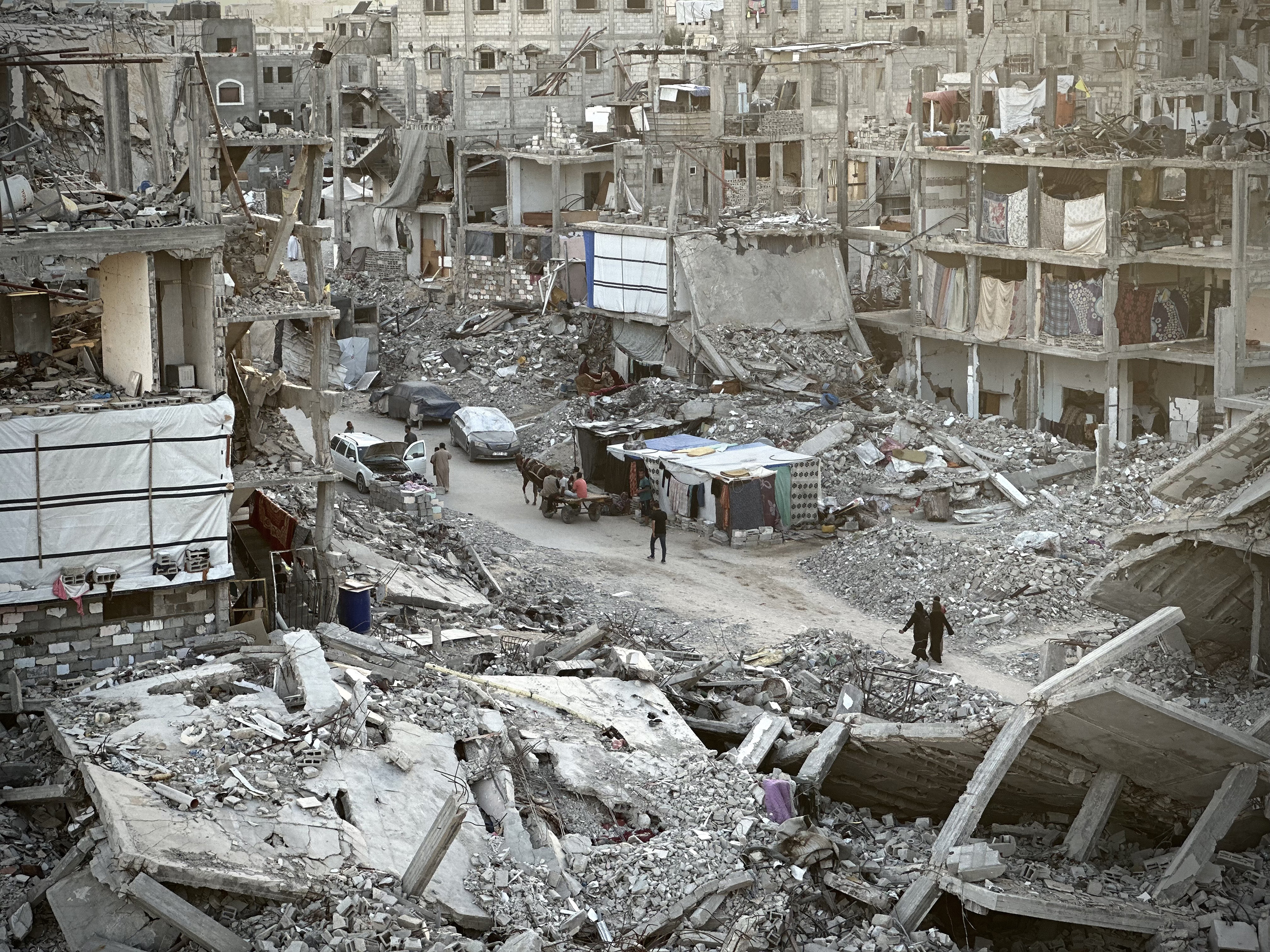 Palestinians in Khan Younis city are pictured trying to survive their daily lives despite the destroyed buildings and difficult conditions. Israeli bombardments in northern Gaza have killed at least 73 people, Hamas media reports. Photo / Anadolu via Getty Images