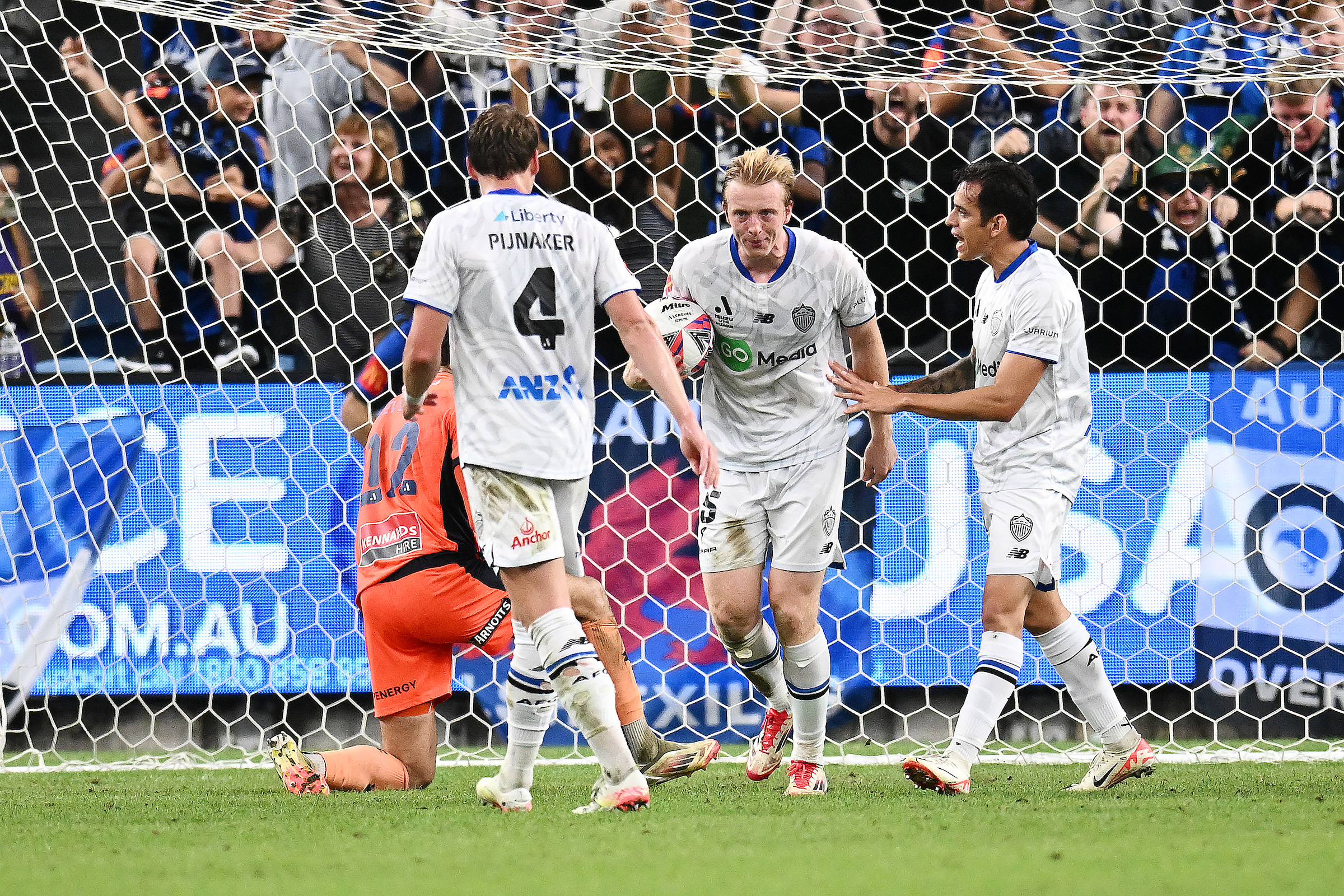 Francis De Vries celebrates with teammates after scoring a goal against Sydney FC. Photo / AAP