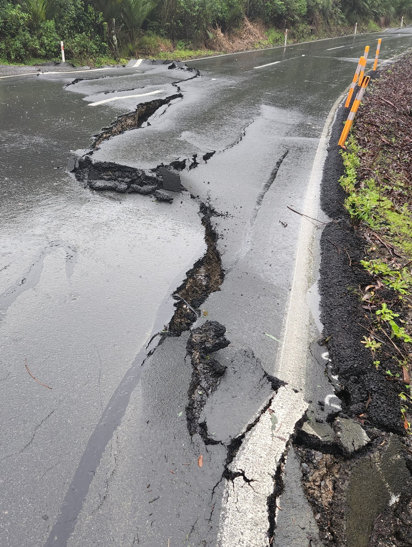 Ground movement has buckled the Mangamuka Gorge road and broken up asphalt. Photo / Waka Kotahi