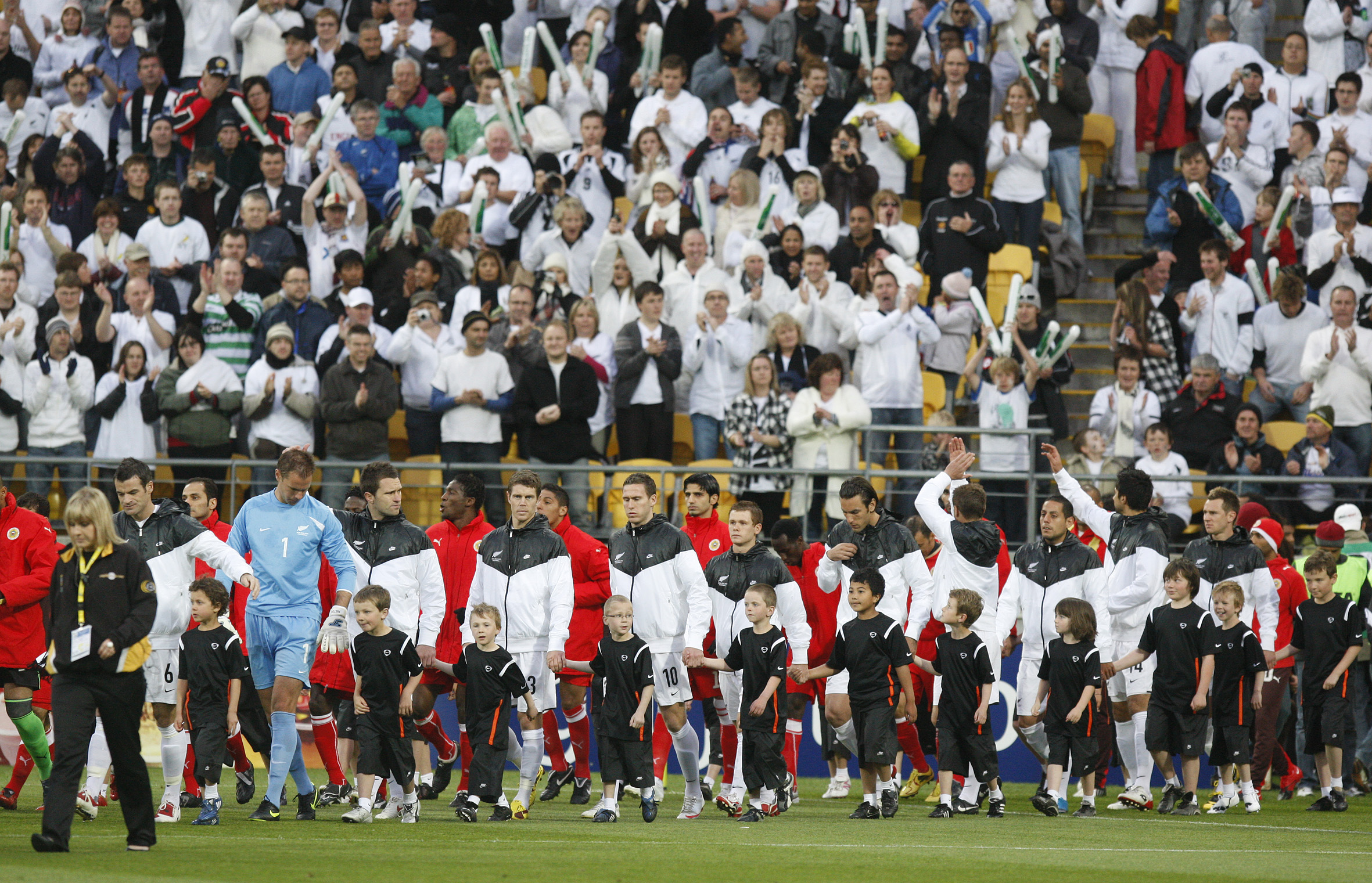 The teams are welcomed on to the pitch before the 2010 FIFA World Cup soccer qualifier between the All Whites and Bahrain. Photo / Mark Mitchell