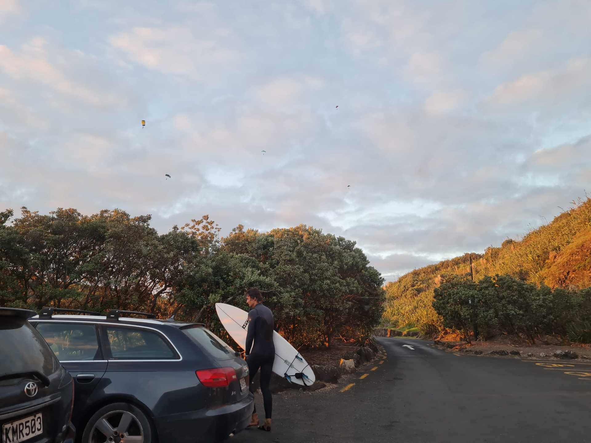 A witness took this photo of five skydivers in the air above Muriwai, minutes before the incident. Photo / Supplied