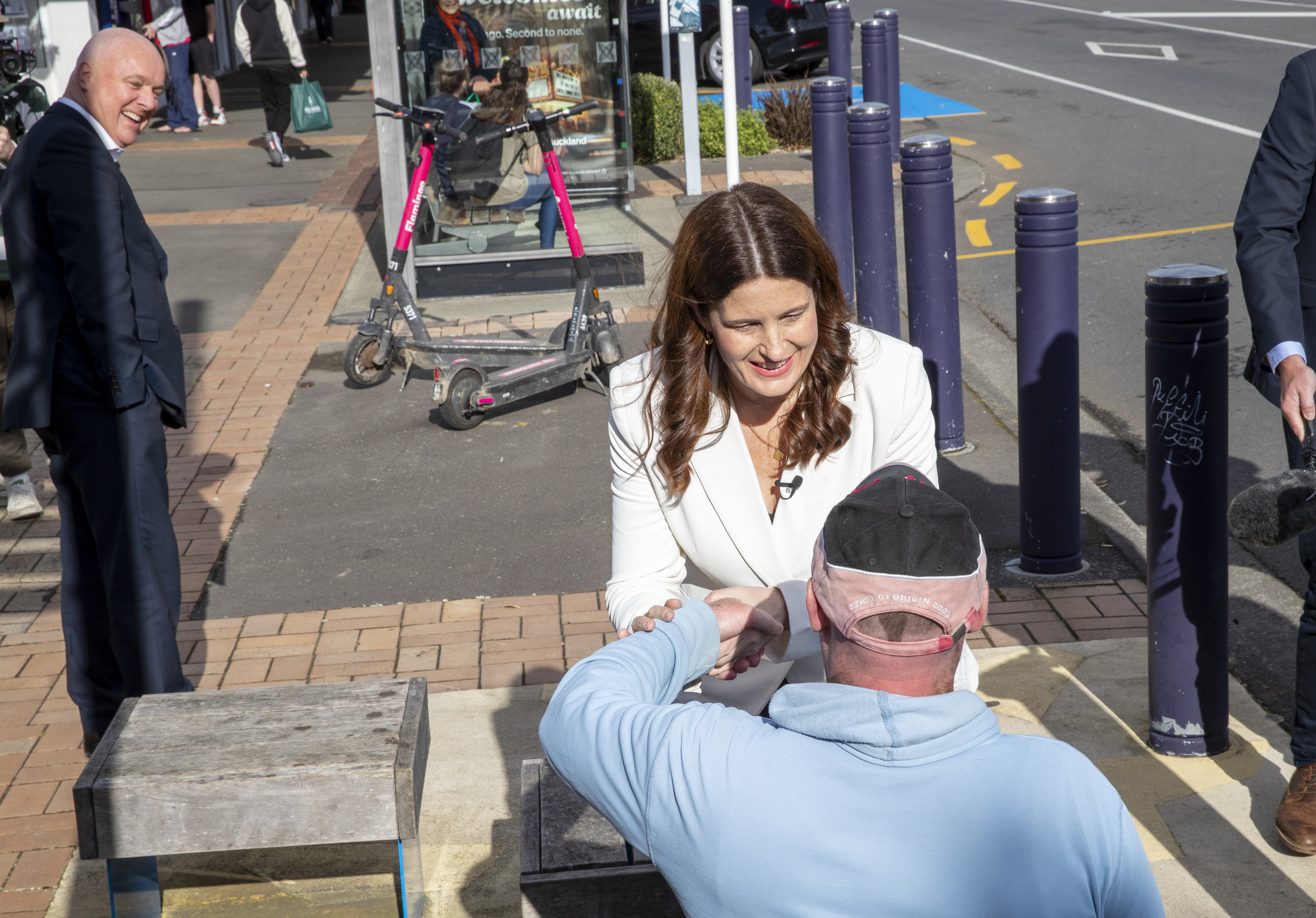 National deputy leader Nicola Willis shaking hands, left-handed, in a 
