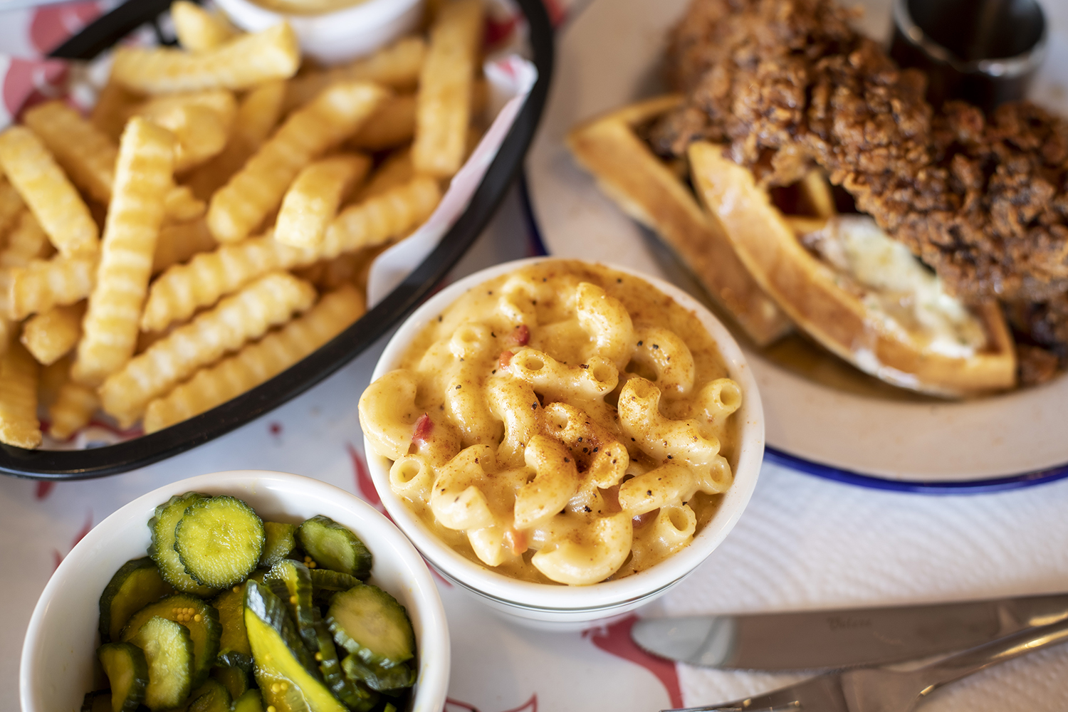 Chicken and waffles and pimento mac 'n' cheese feature on the new menu. Photo / Michael Craig. 