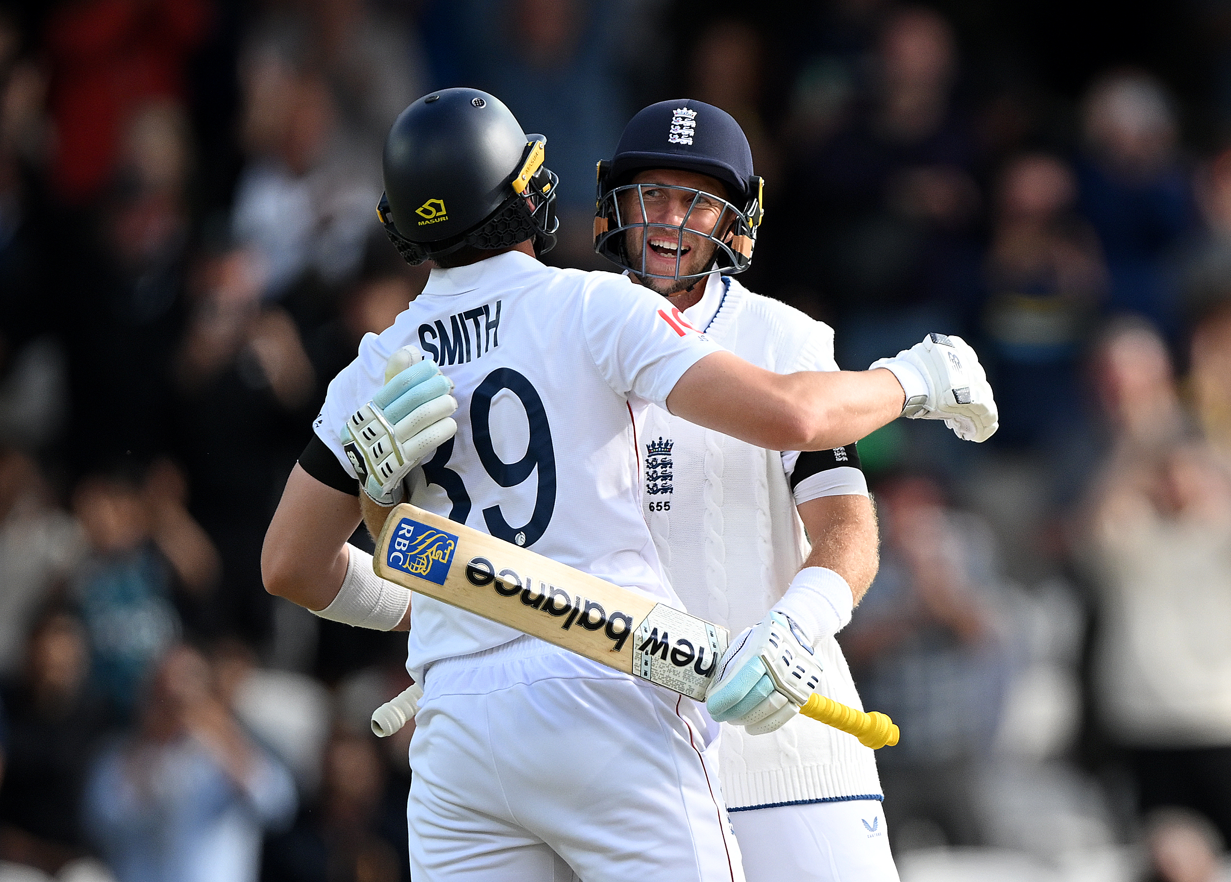 Joe Root and Jamie Smith of England celebrate victory after day five of the first test between England and India at Headingley. Photo / Getty Images