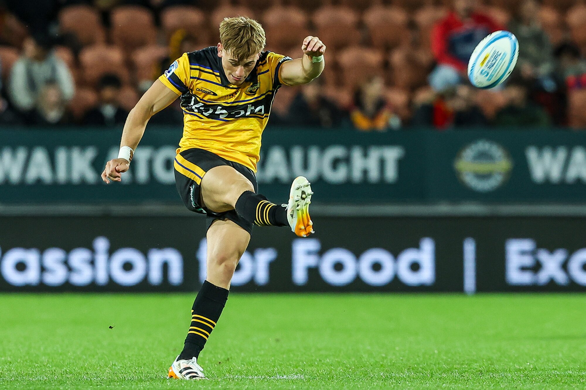 Hurricanes first five-eighths Ruben Love boots the ball against the Chiefs, in Hamilton.  Photo / Photosport