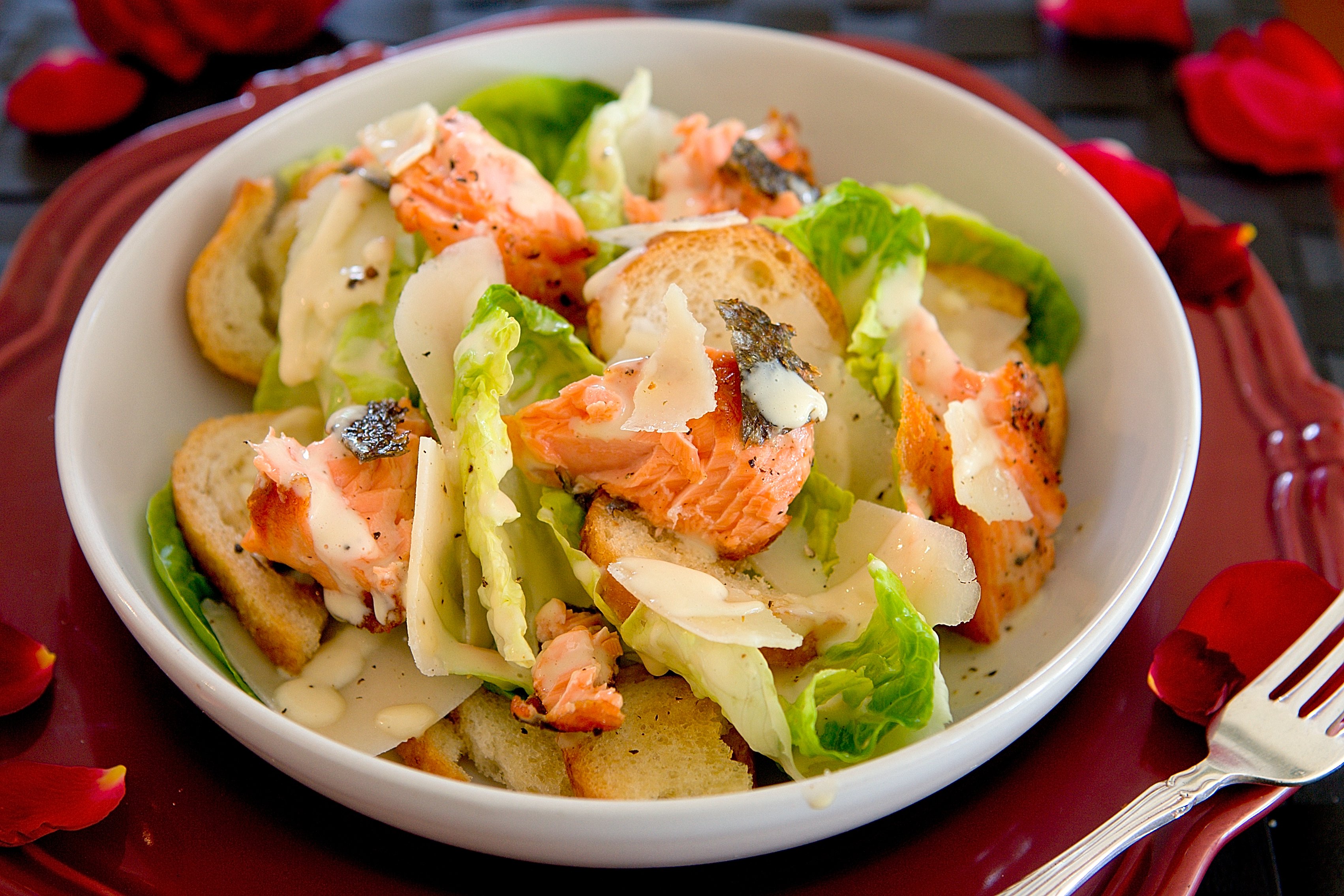 Skinned salmon is a delicious addition to a Caesar salad. Photo / Babiche Martens