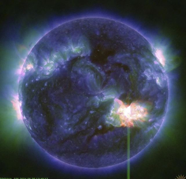 A solar flare, as seen in the bright flash in the lower right, captured by Nasa’s Solar Dynamics Observatory. Photo / AP