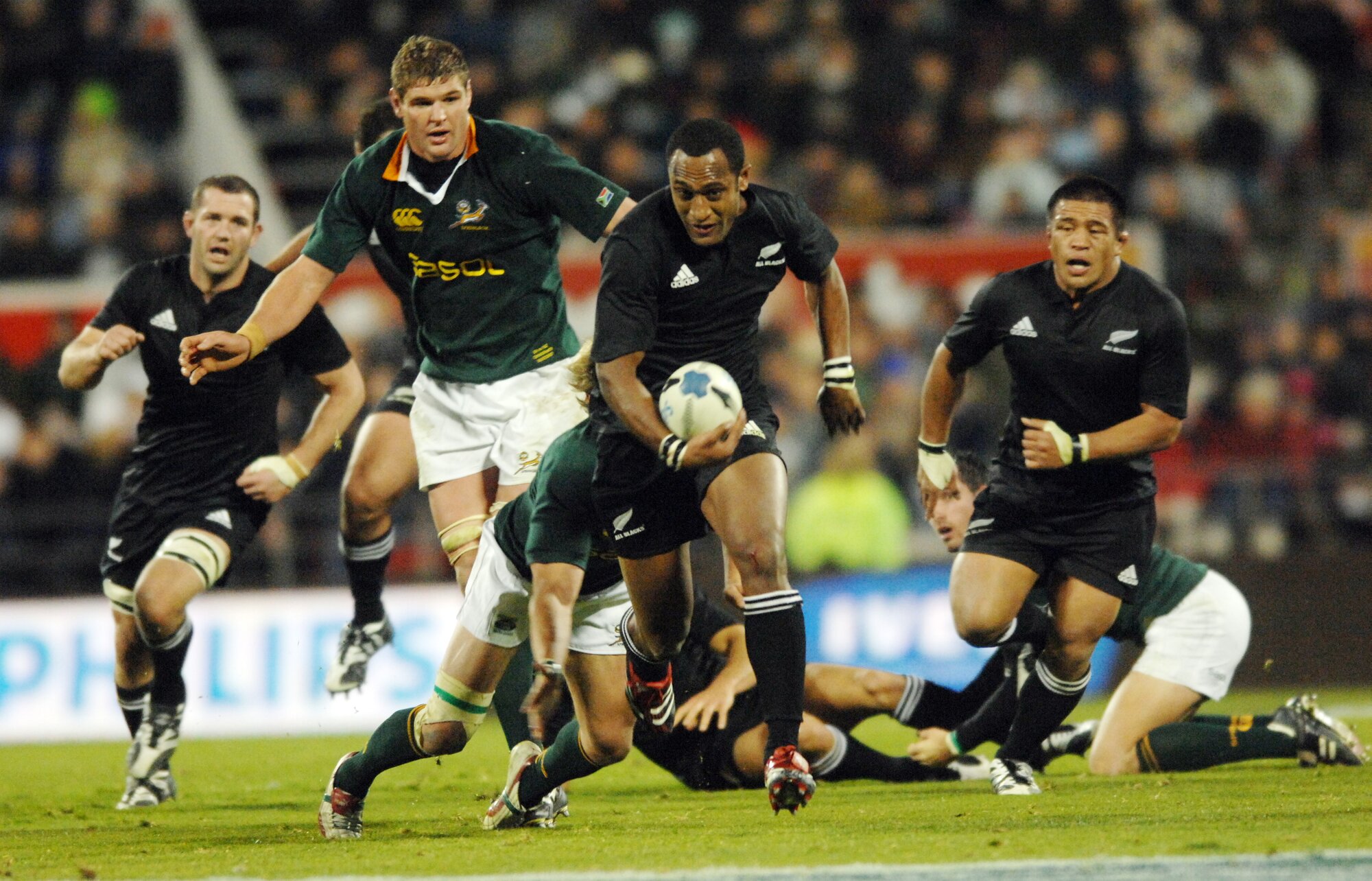All Blacks winger Joe Rokocoko splits the Springboks defence in Christchurch.  Photo / NZPA