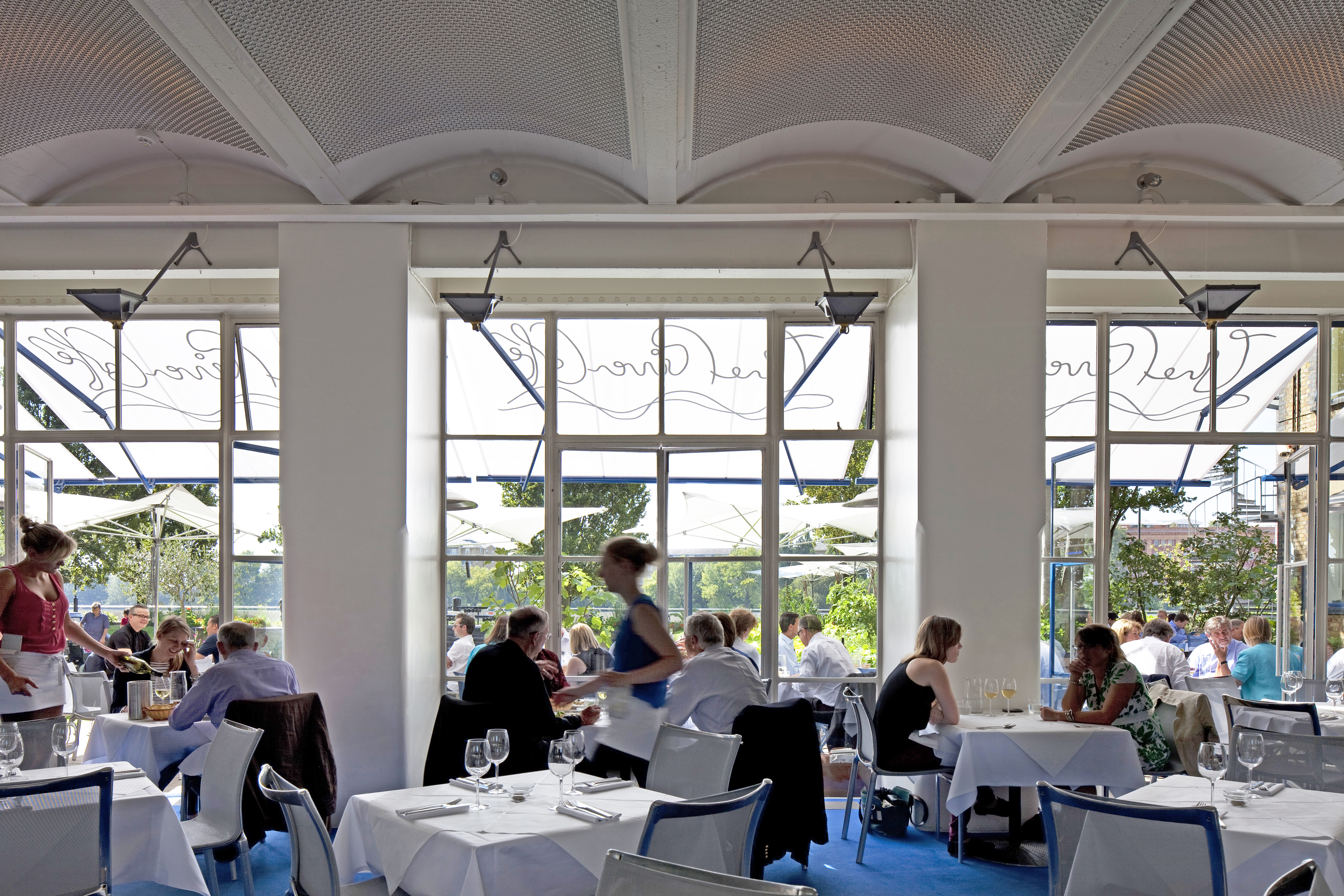 The indoor and outdoor dining rooms at London’s River Cafe. Photo / Richard Bryant