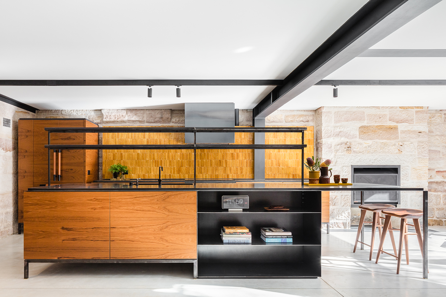 An industrial urban aesthetic defines the revamped kitchen of the Paddington house. Photo / Supplied