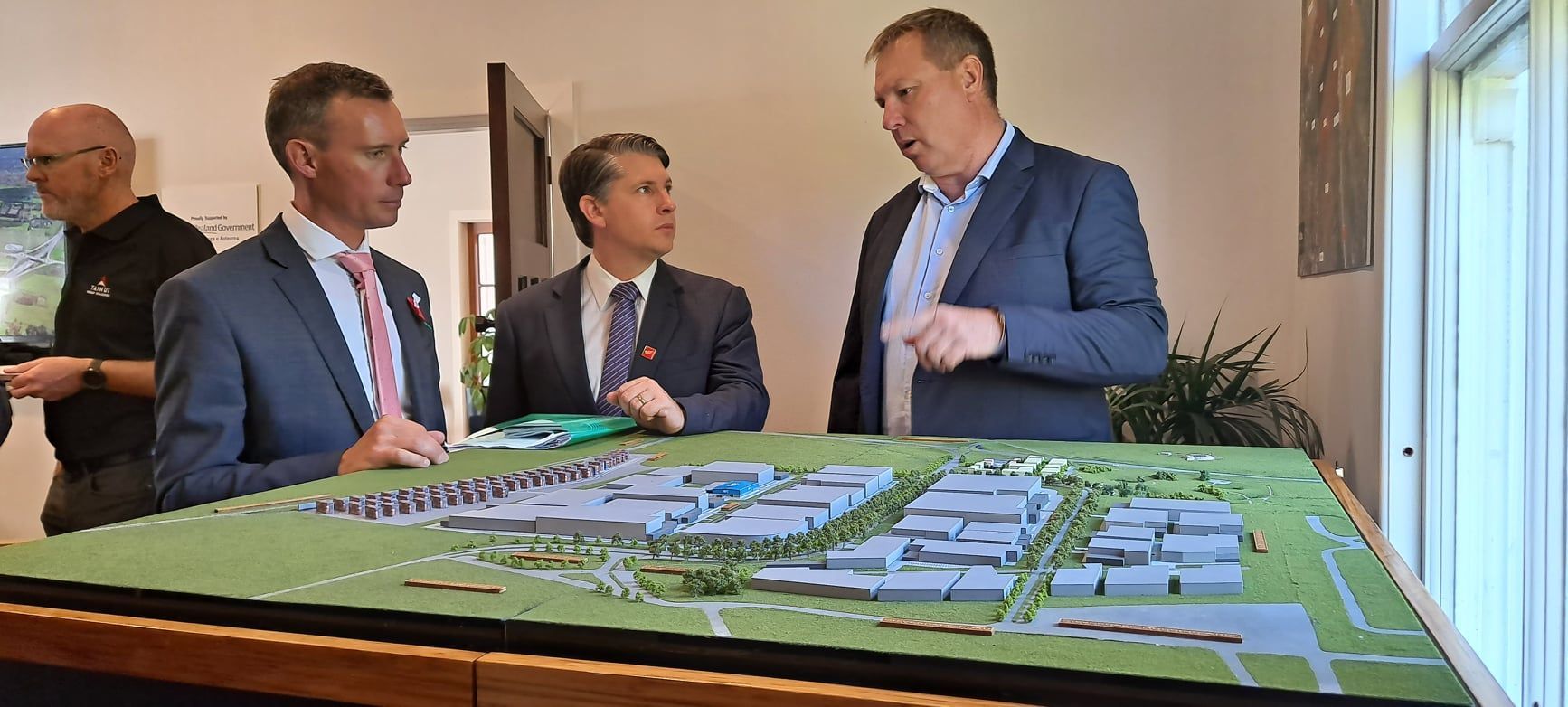 Hamilton East MP Jamie Strange, Minister of Transport Michael Wood and Tainui Group Holdings CEO Chris Joblin discuss the Ruakura Superhub. Photo / Jamie Strange - facebook