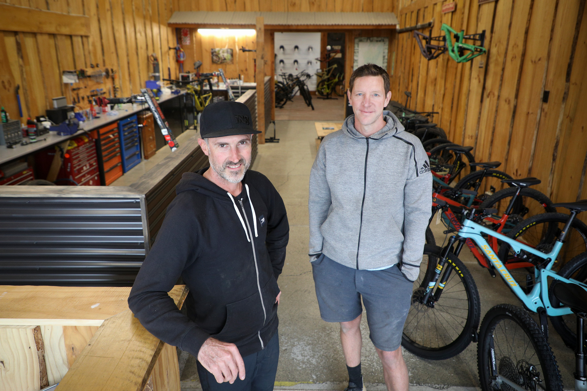 Bike Culture co-owner Rob Smail (left) and developer Tony Bradley at the new-look Bike Culture store in the former Outdoorsman Headquarters building on Tarawera Rd. Photo / Andrew Warner