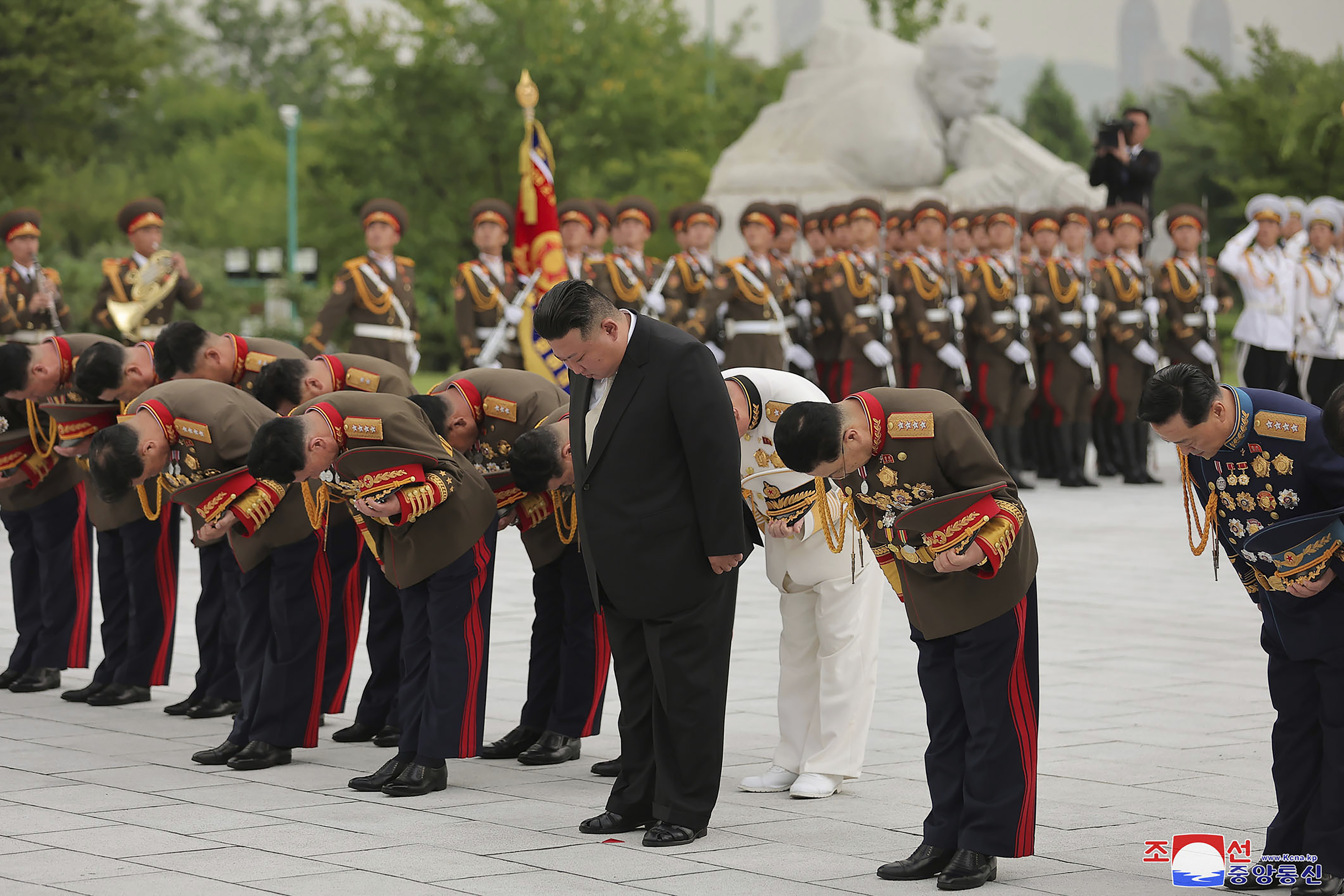 In this photo provided by the North Korean government, North Korean leader Kim Jong Un (centre, front) visits a 