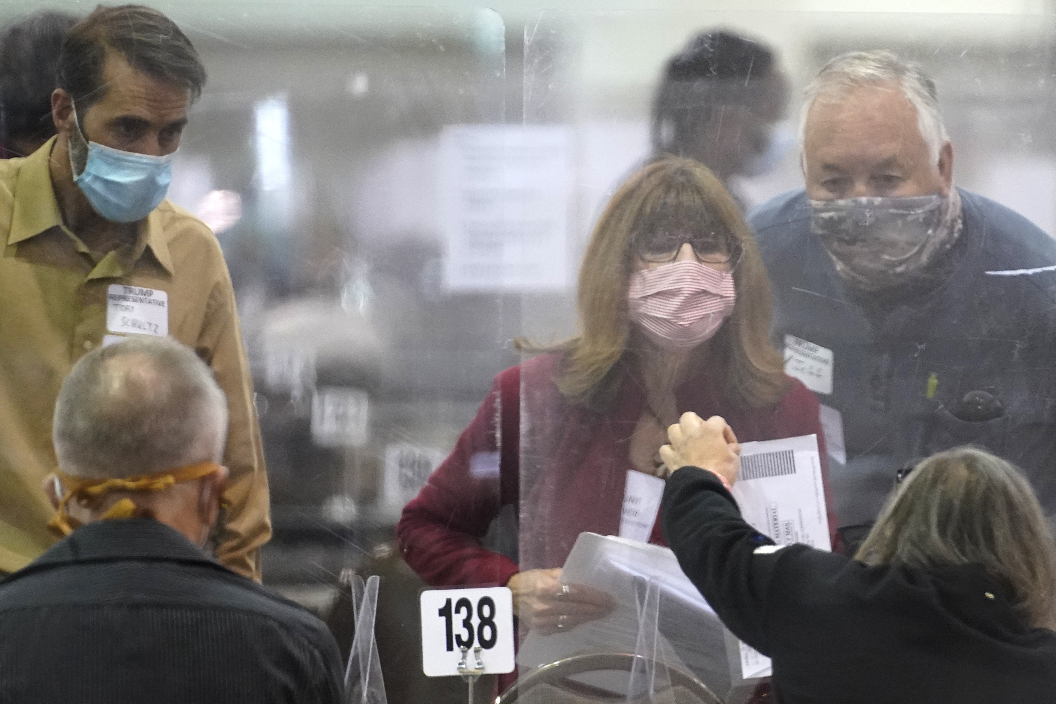 Recount observers check ballots during a Milwaukee hand recount of presidential votes at the Wisconsin Center on November 20, 2020. Photo / AP